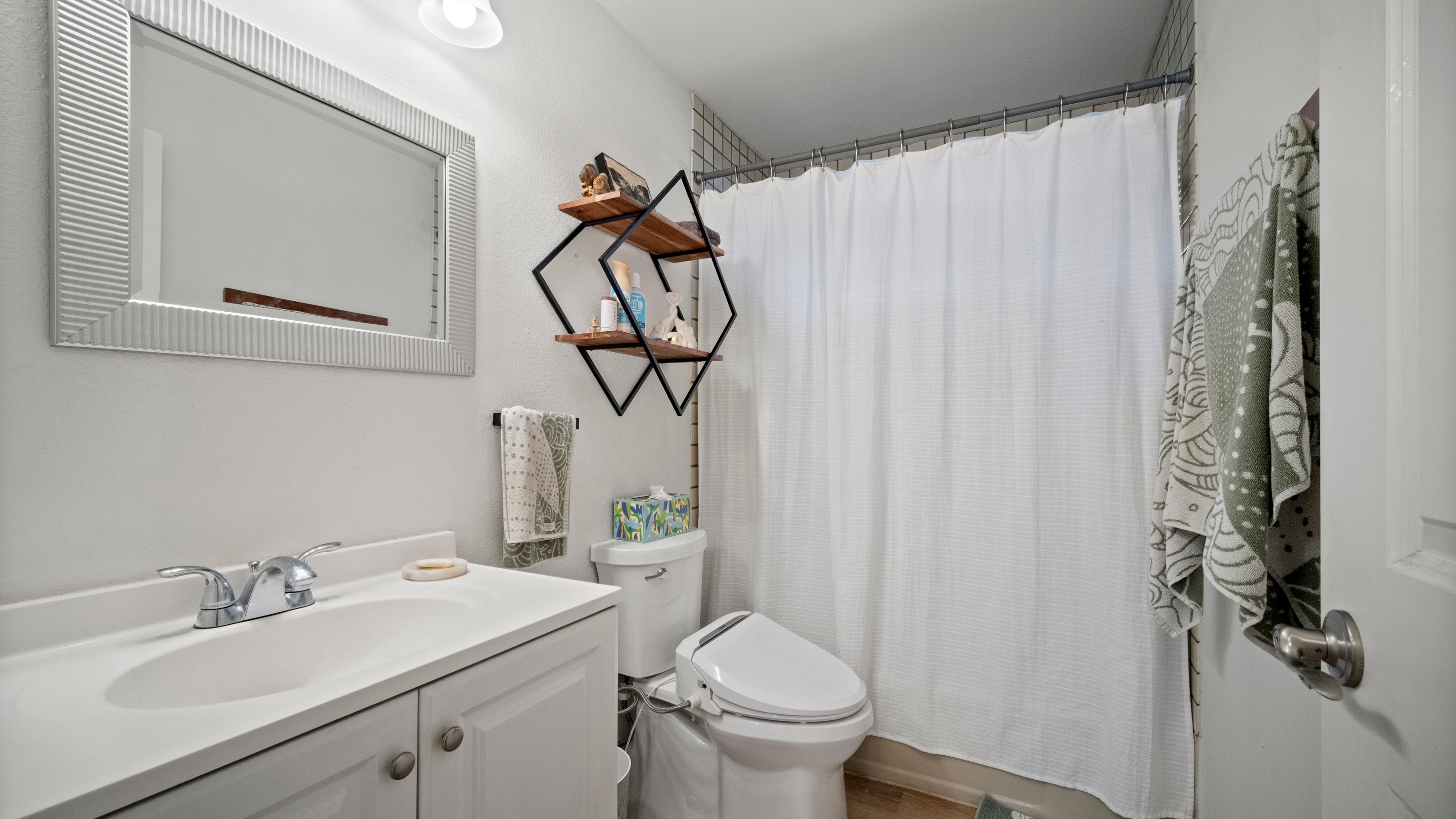4121 Rice Street, Unit 2708 Lihue, HI 96766 - Photo 16 of 29 a bathroom with a sink toilet and shower