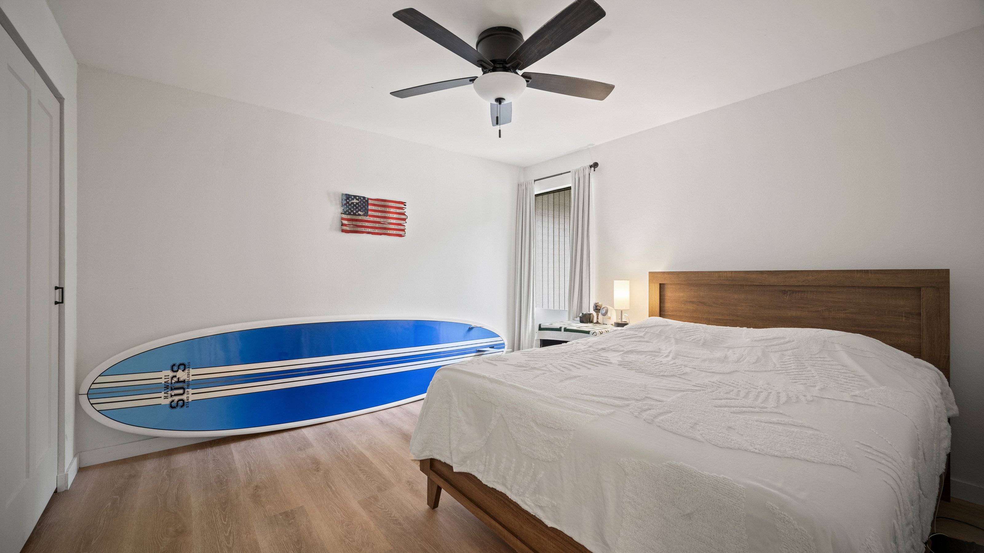 4121 Rice Street, Unit 2708 Lihue, HI 96766 - Photo 19 of 29 a bedroom with a bed and a ceiling fan