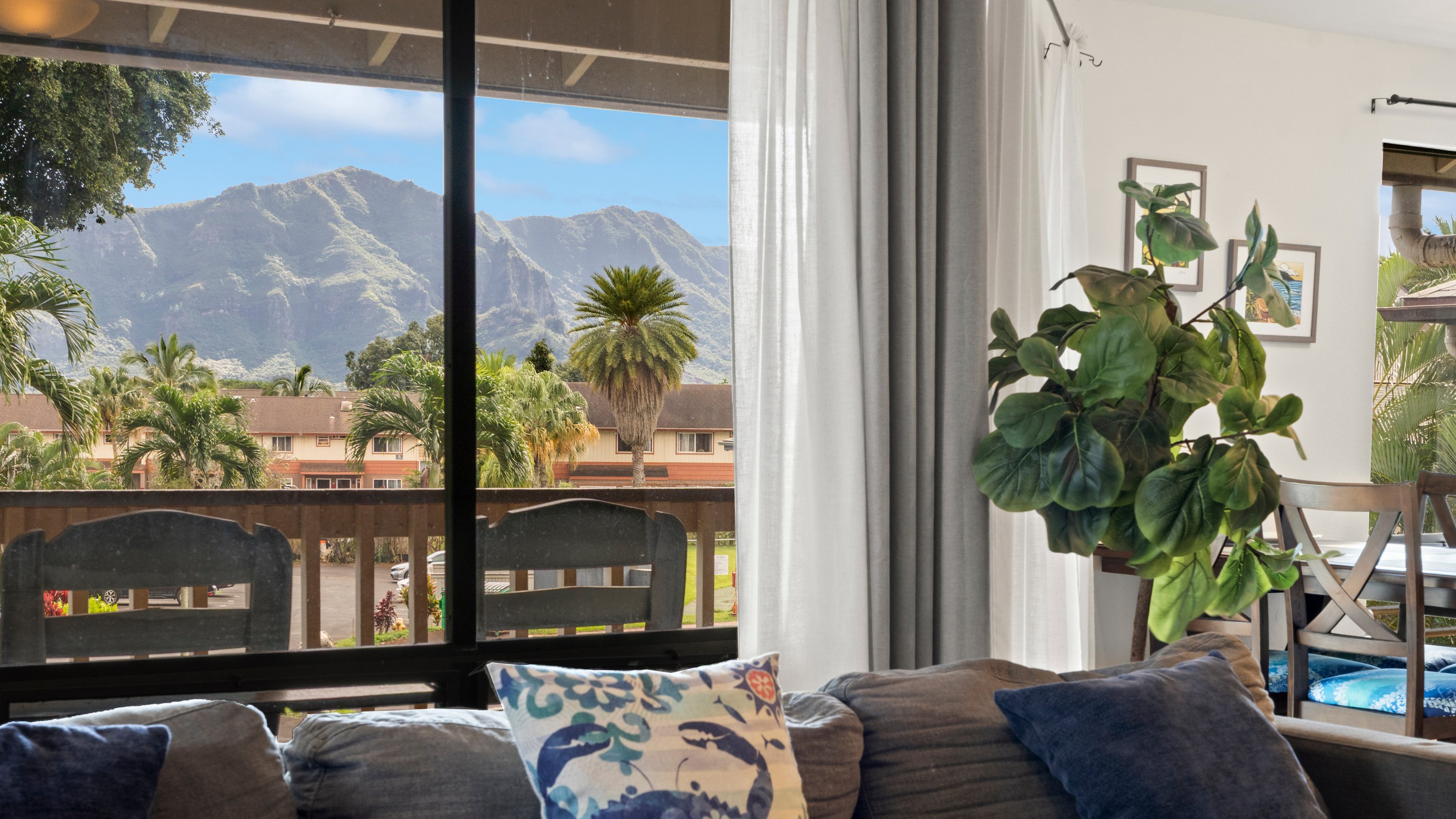 4121 Rice Street, Unit 2708 Lihue, HI 96766 - Photo 3 of 29 a living room filled with furniture and a potted plant