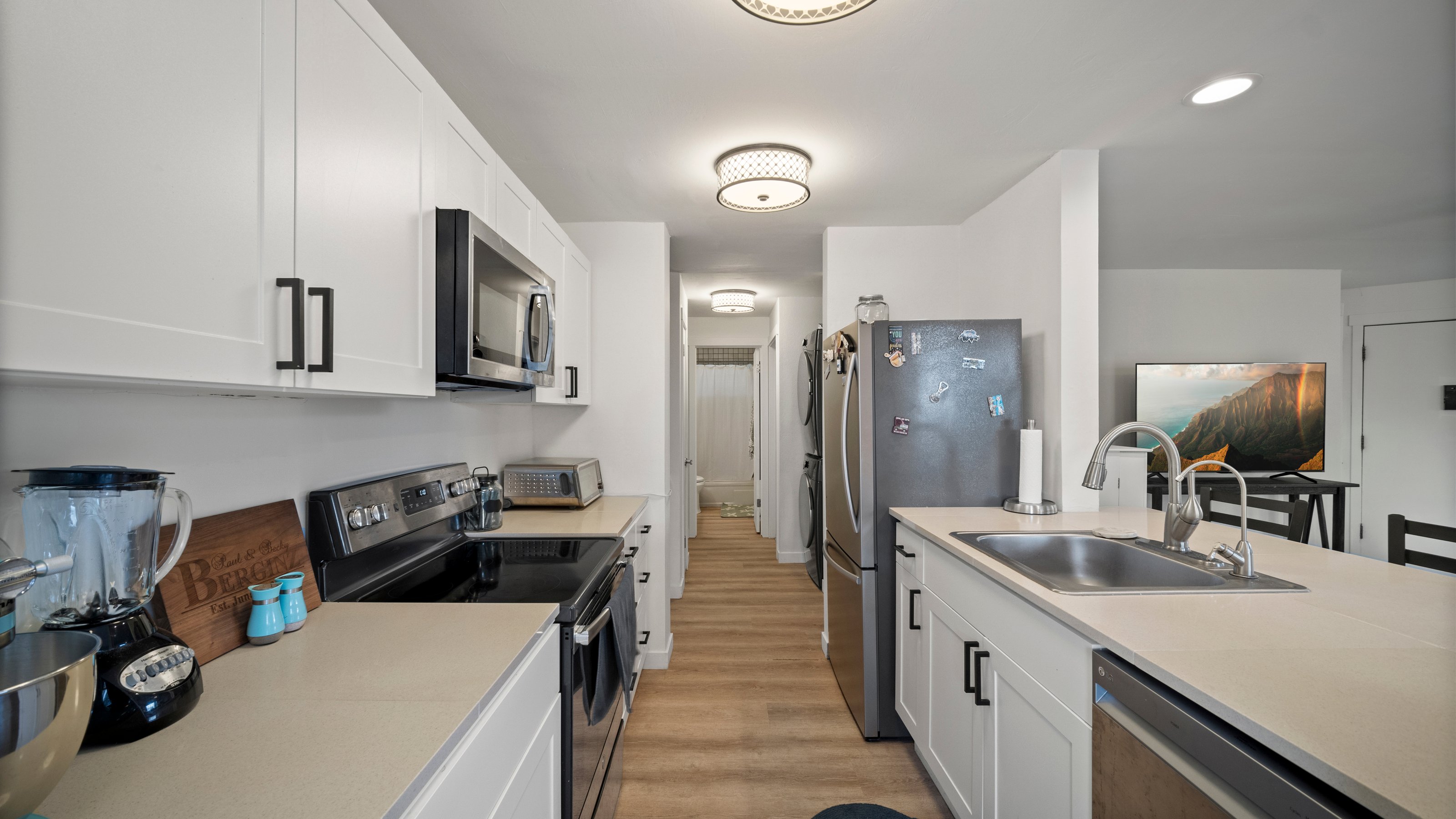 4121 Rice Street, Unit 2708 Lihue, HI 96766 - Photo 7 of 29 a kitchen with a sink stove and refrigerator