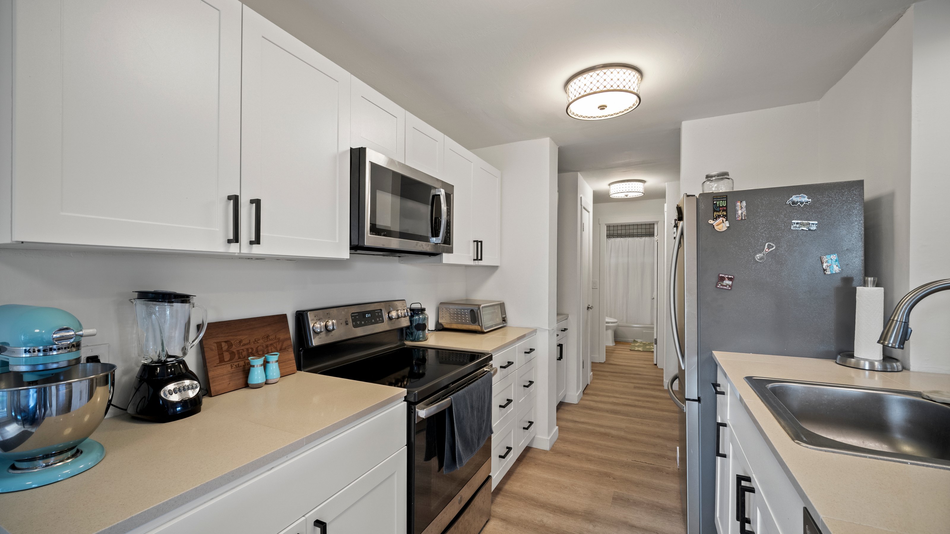 4121 Rice Street, Unit 2708 Lihue, HI 96766 - Photo 8 of 29 a kitchen that has a sink and a stove