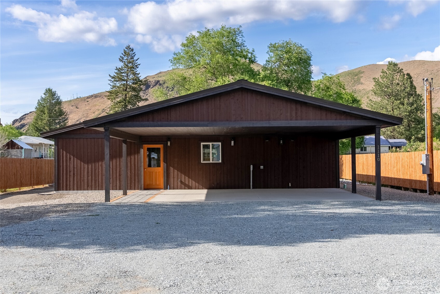1110 Riverside Avenue Twisp, WA 98856 - Photo 2 of 28 a front view of a house with a yard