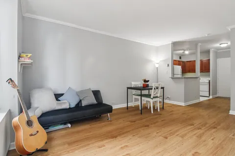 a work room with furniture and wooden floor
