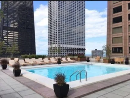 a view of terrace with seating space and building view