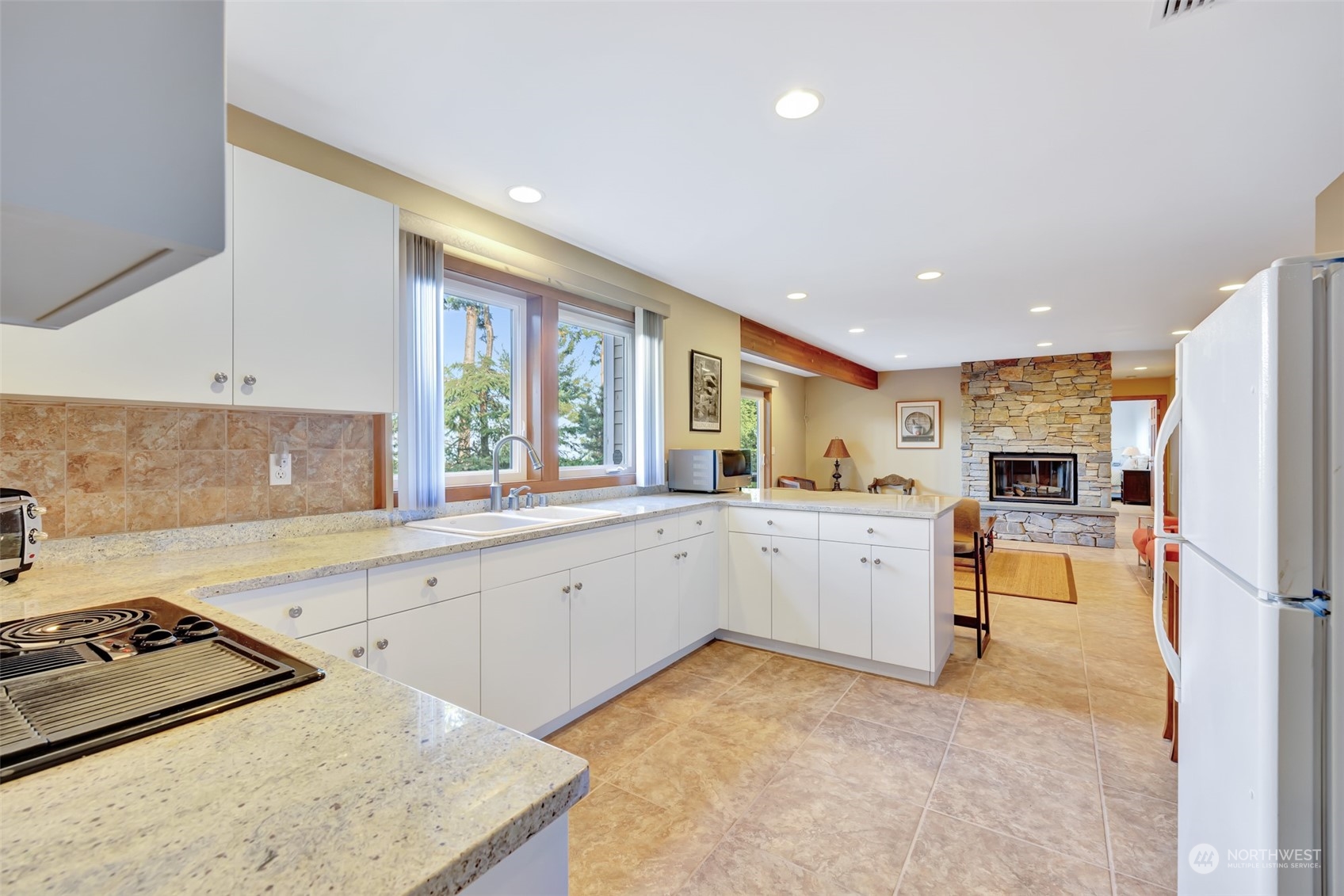 372 Owls Nest Road Sequim, WA 98382 - Photo 34 of 40 a kitchen with a sink stove and refrigerator
