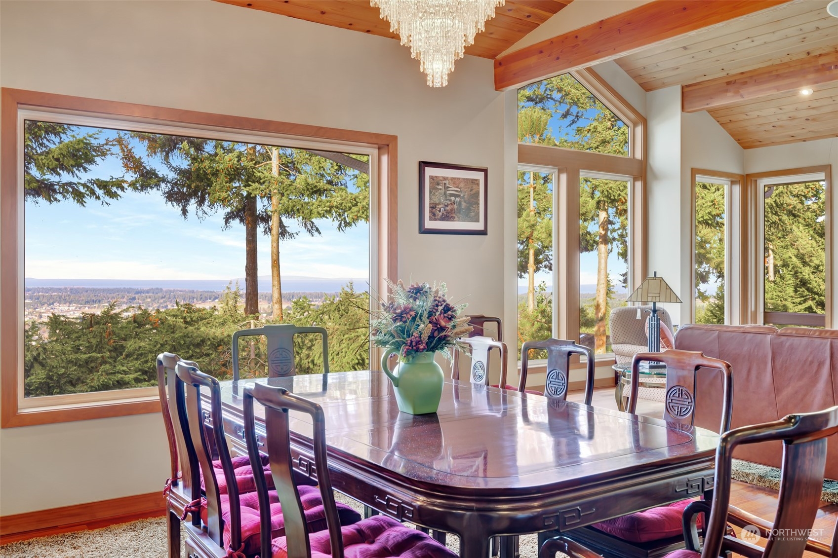 372 Owls Nest Road Sequim, WA 98382 - Photo 8 of 40 a view of a dining room with furniture large windows and wooden floor