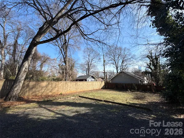 a view of a backyard of the house