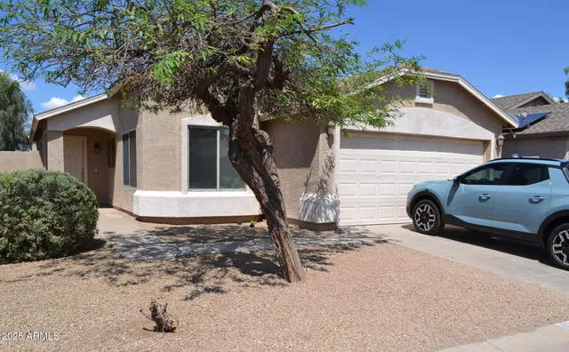 a view of a car in front of a house