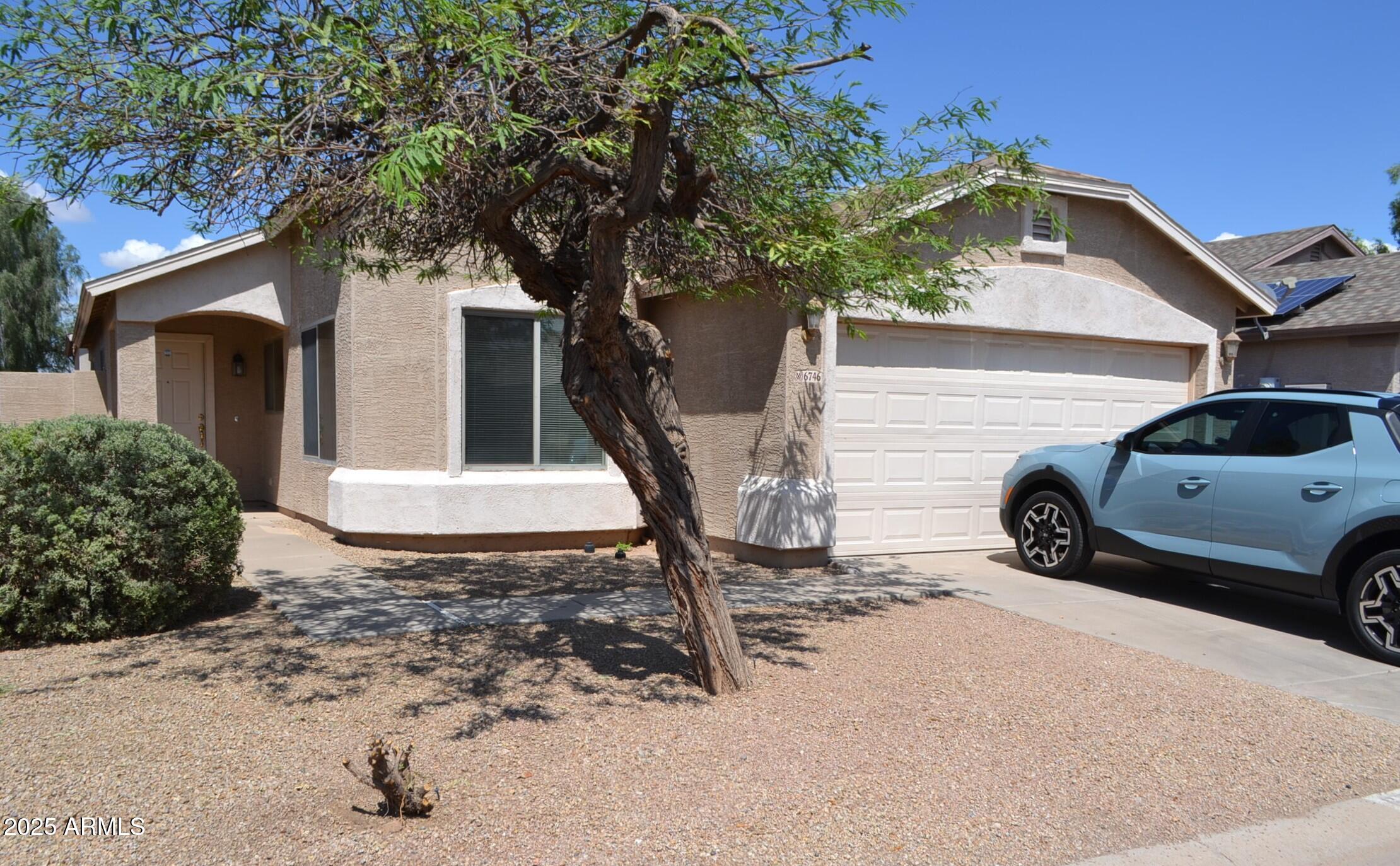 a view of a car in front of a house
