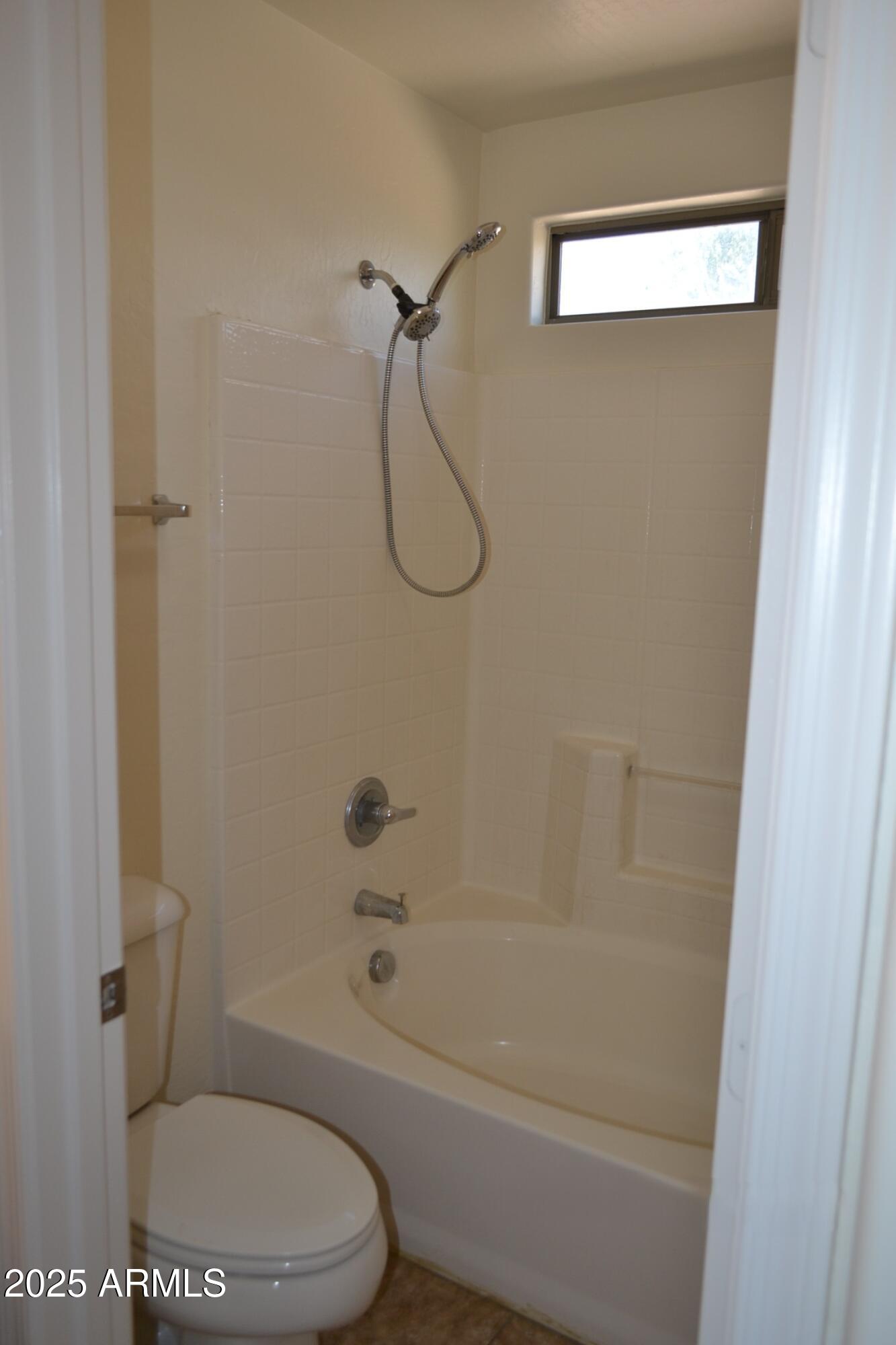 6746 East Superstition Way Florence, AZ 85132 - Photo 16 of 19 a bathroom with a toilet and a shower