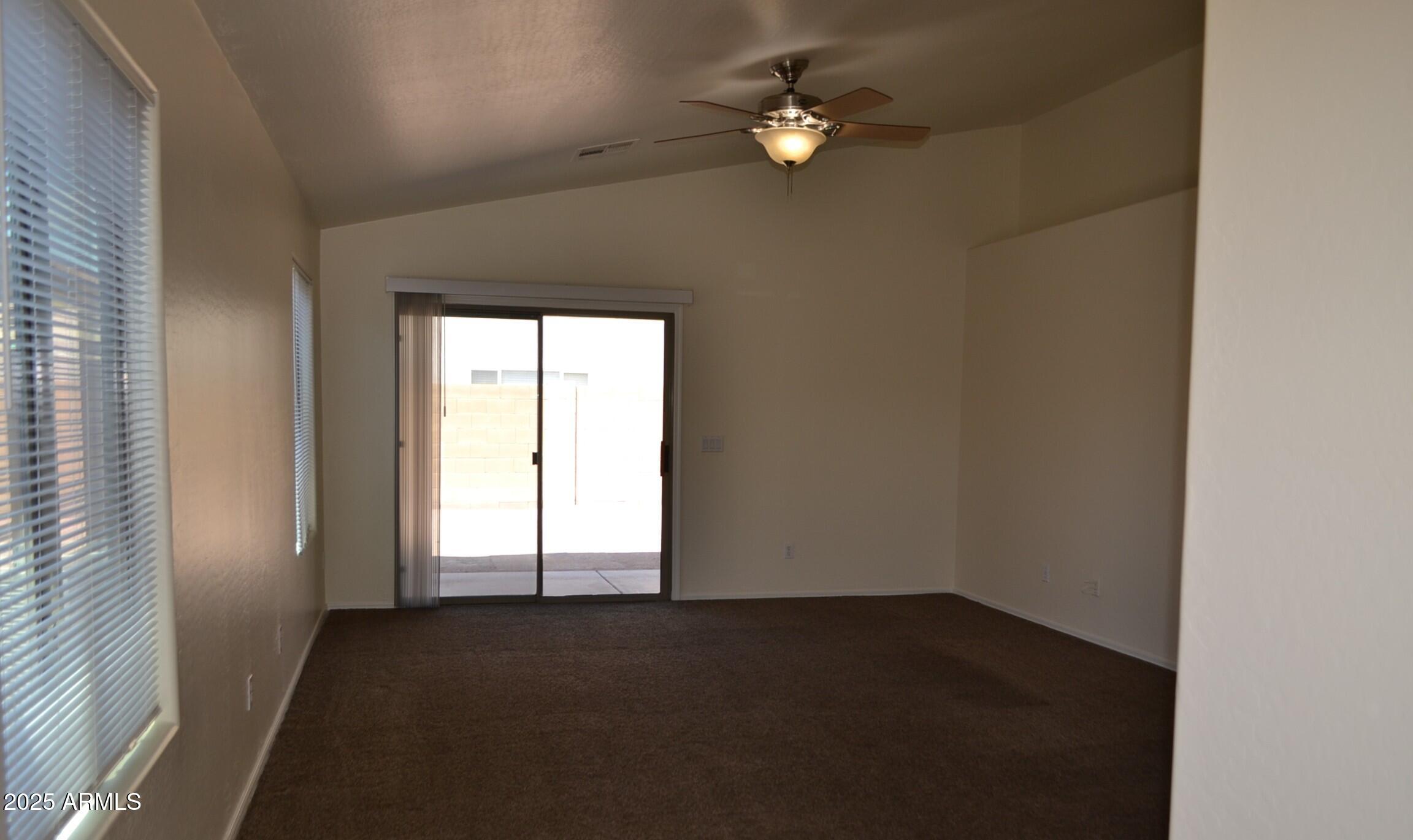 6746 East Superstition Way Florence, AZ 85132 - Photo 2 of 19 an empty room with windows