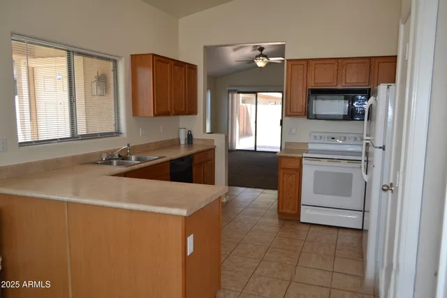 a kitchen with a sink and window