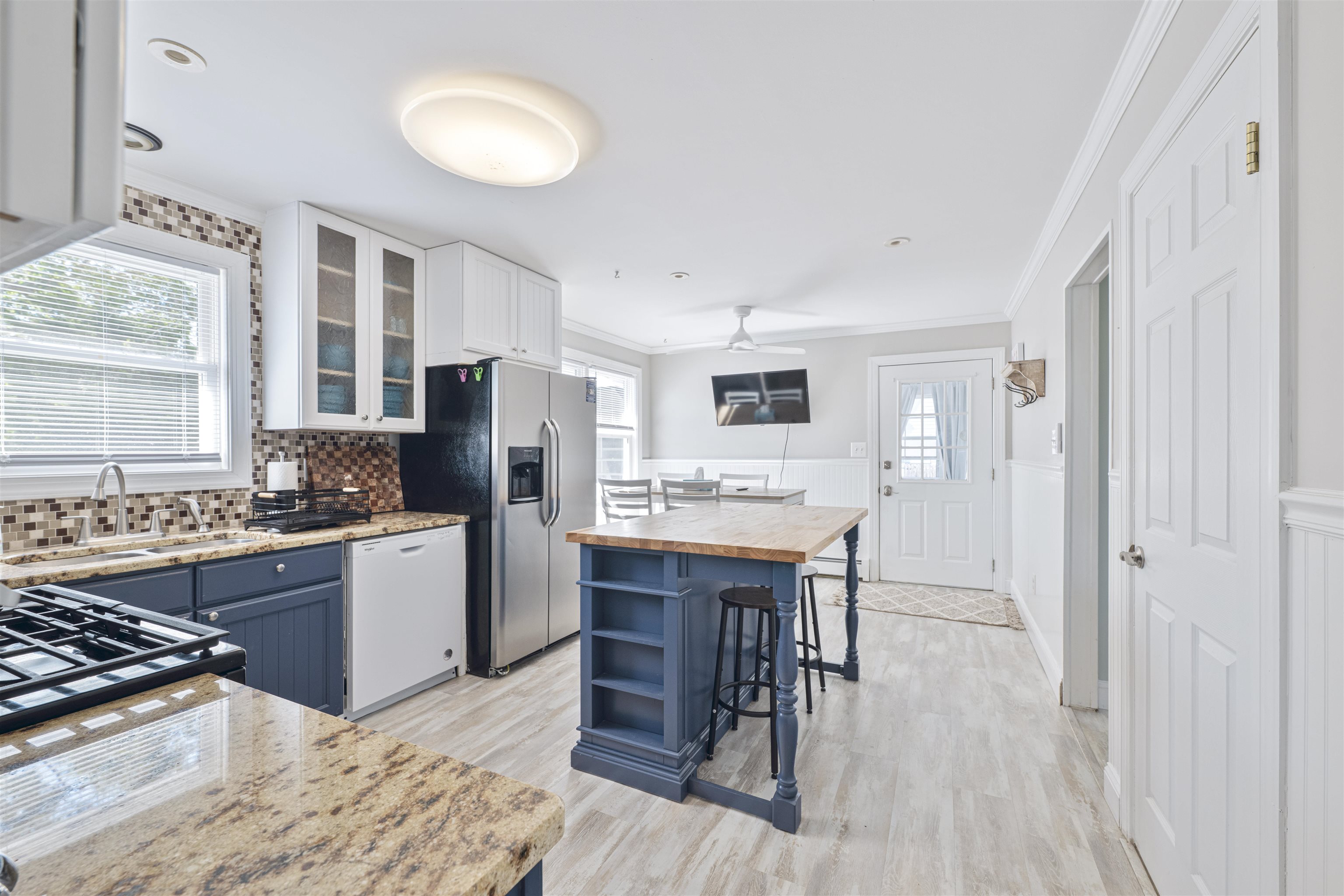 18 Pinewood Road Cape May, NJ 08204 - Photo 14 of 50 a kitchen with stainless steel appliances granite countertop a stove refrigerator and a sink