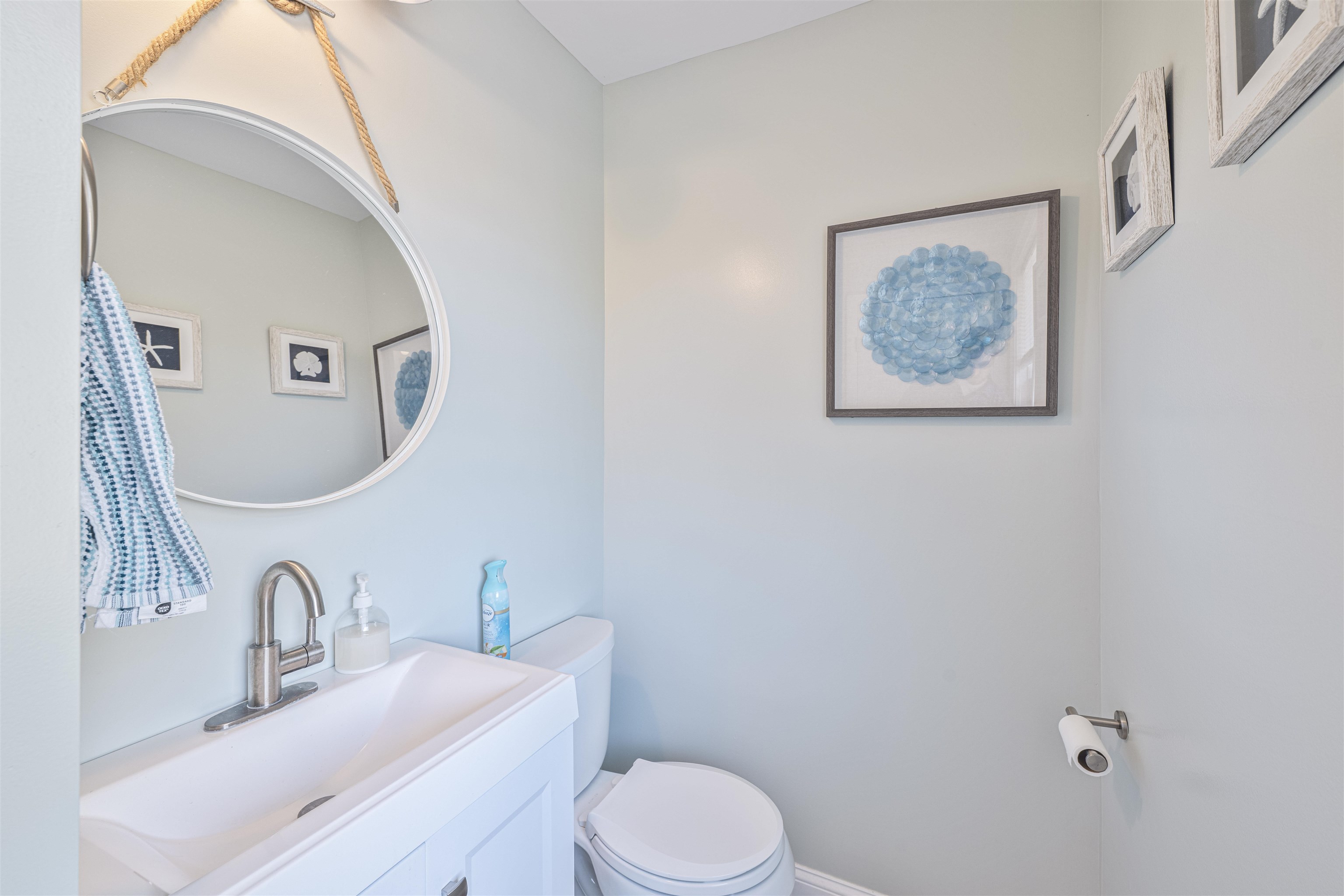 18 Pinewood Road Cape May, NJ 08204 - Photo 23 of 50 a bathroom with a toilet sink vanity and mirror