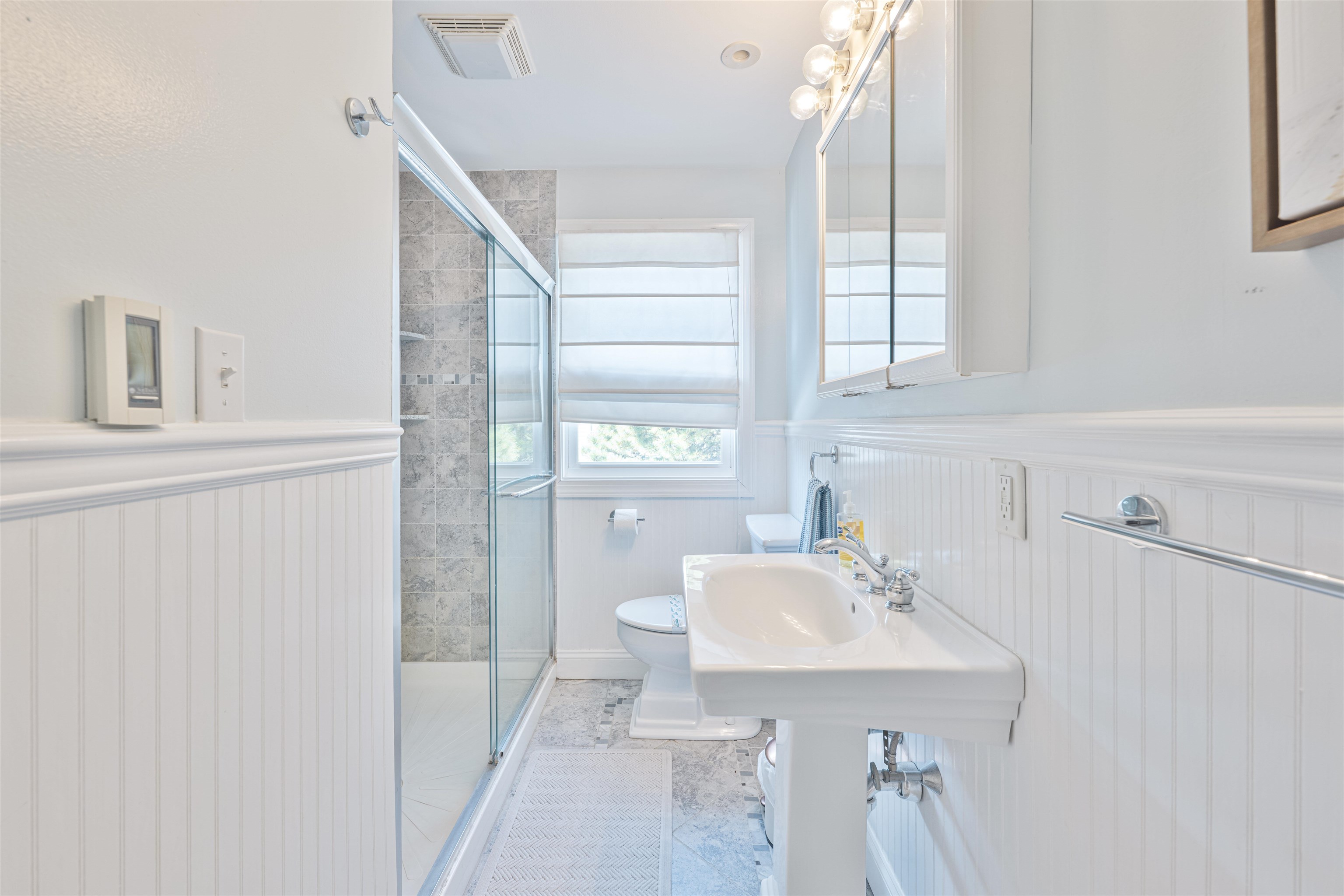 18 Pinewood Road Cape May, NJ 08204 - Photo 31 of 50 a bathroom with a sink a toilet and shower
