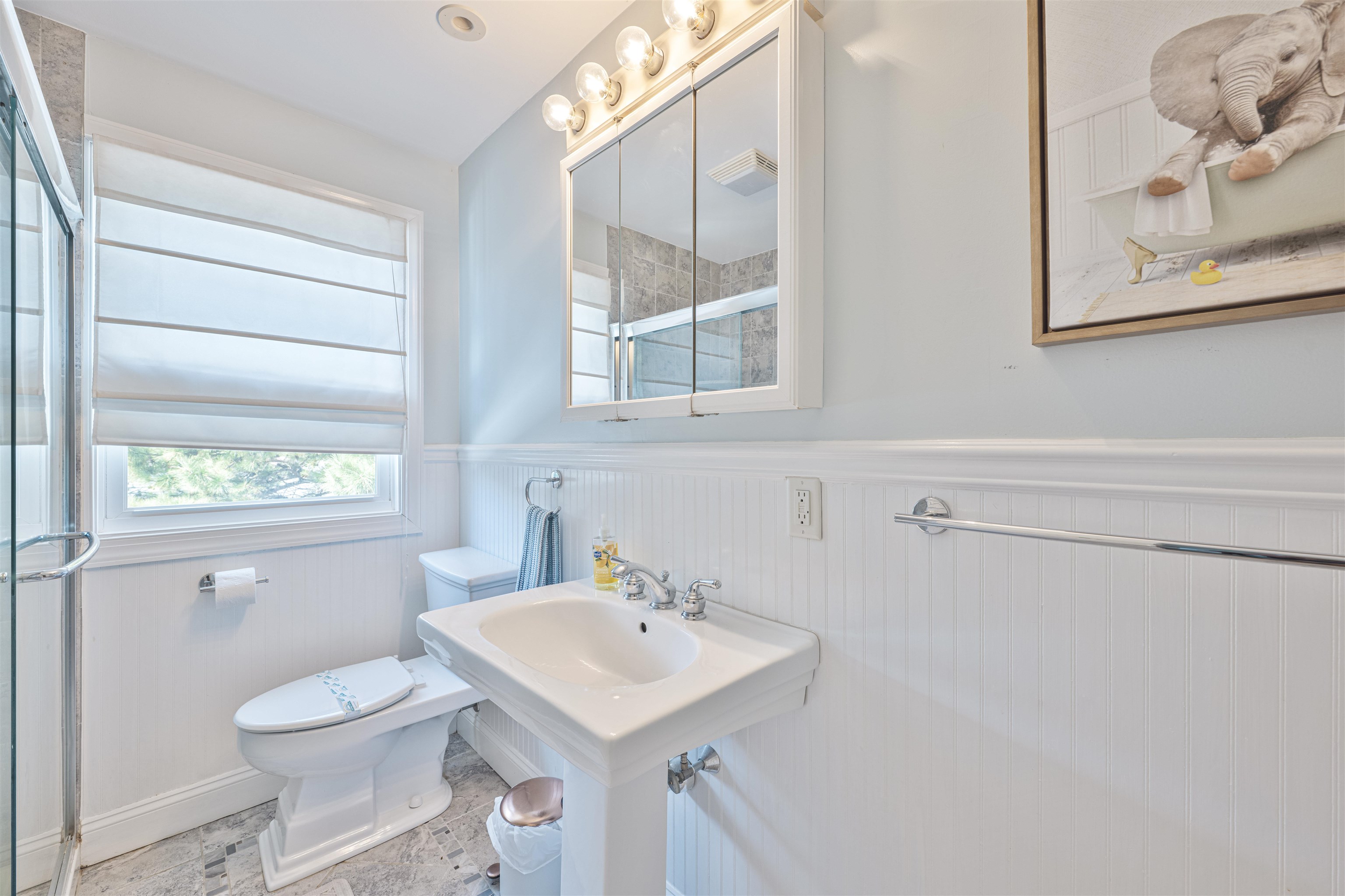 18 Pinewood Road Cape May, NJ 08204 - Photo 32 of 50 a bathroom with a sink toilet and vanity