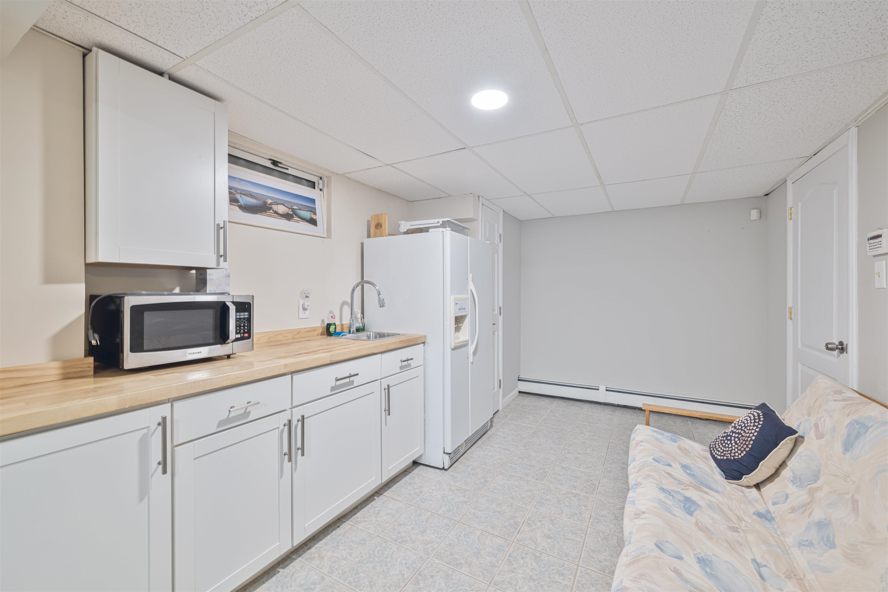 18 Pinewood Road Cape May, NJ 08204 - Photo 41 of 50 a spacious bathroom with a granite countertop sink and a mirror