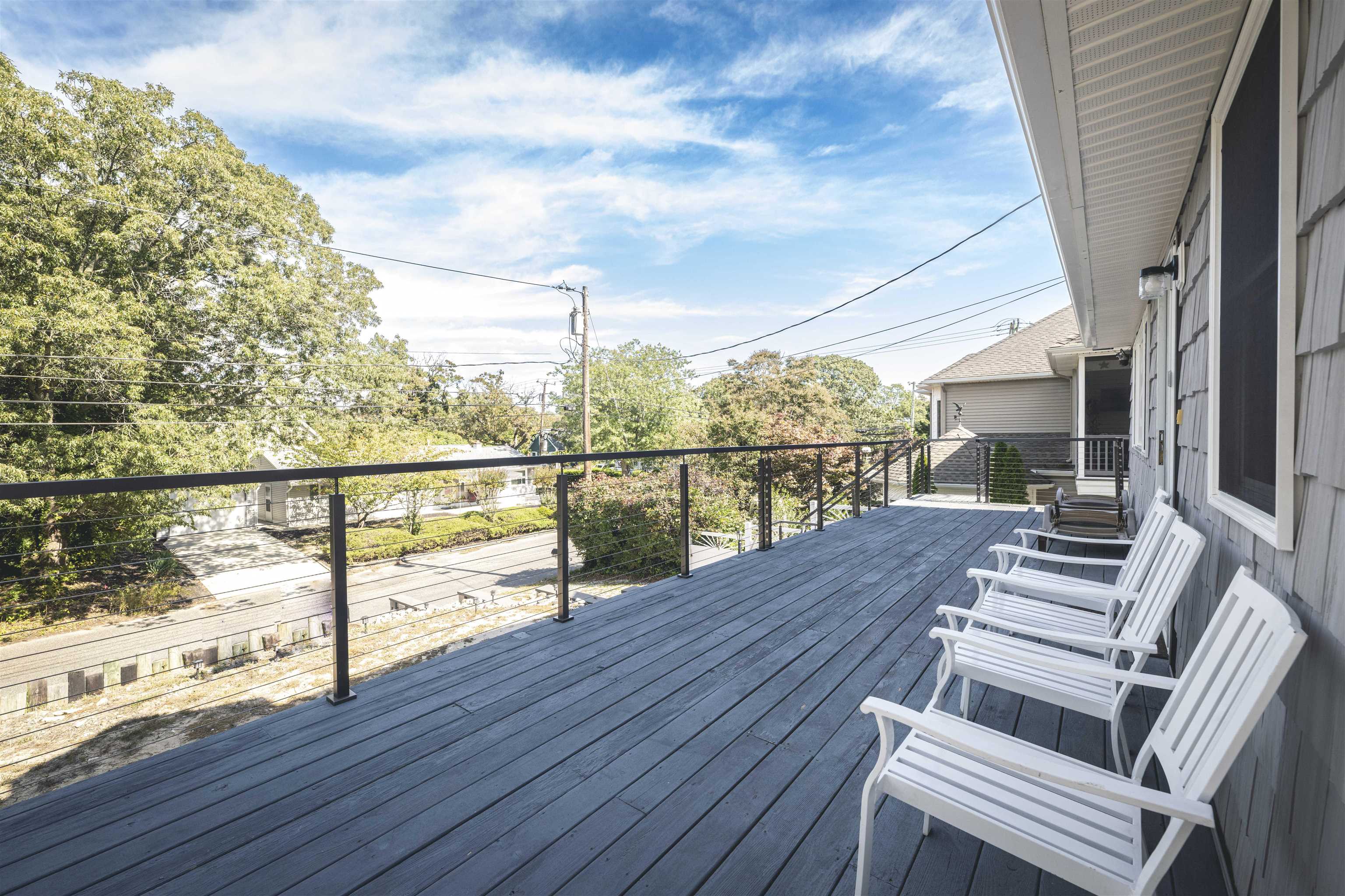 18 Pinewood Road Cape May, NJ 08204 - Photo 45 of 50 a view of balcony with wooden floor and outdoor seating