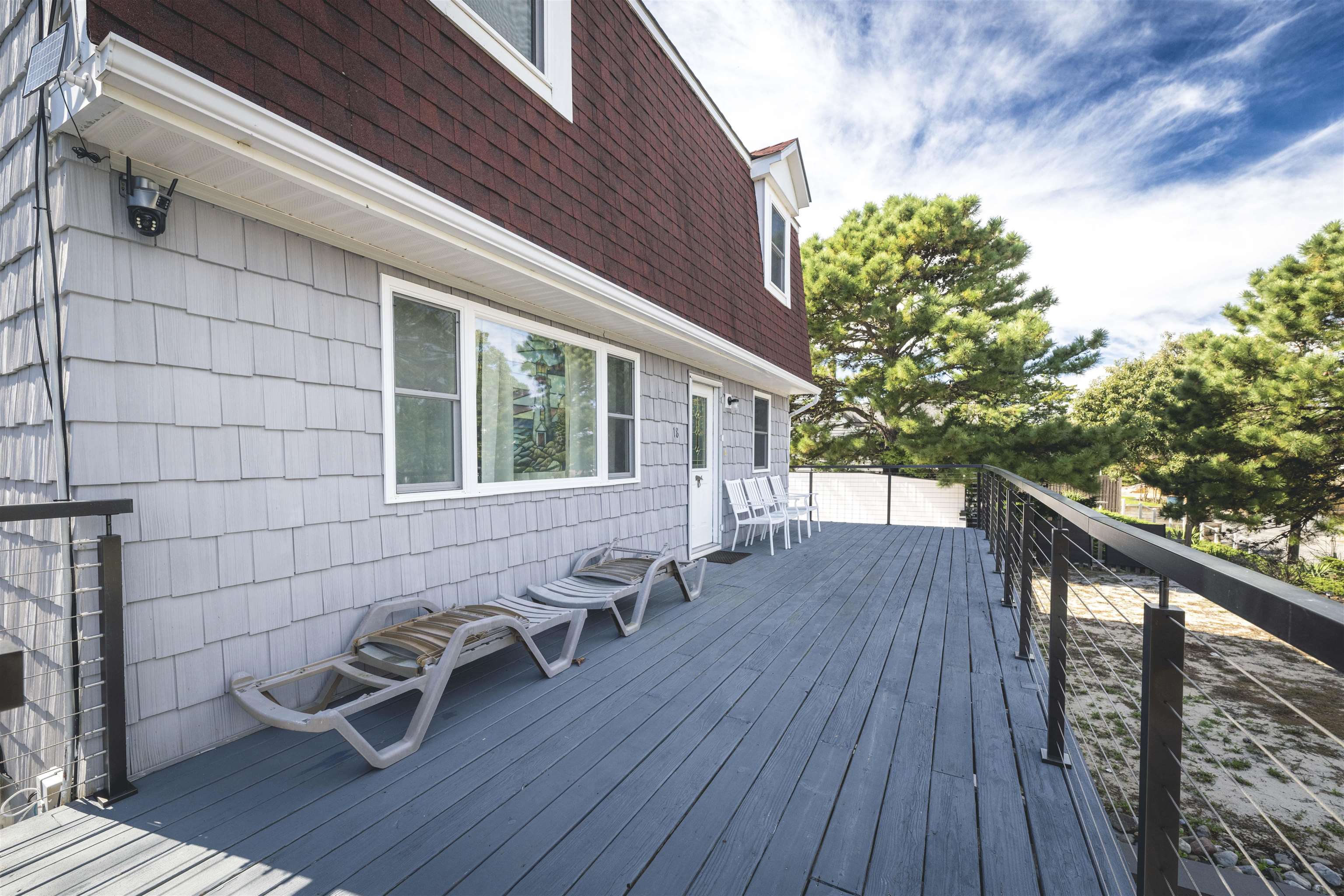 18 Pinewood Road Cape May, NJ 08204 - Photo 46 of 50 a view of a deck with wooden floor and outdoor seating