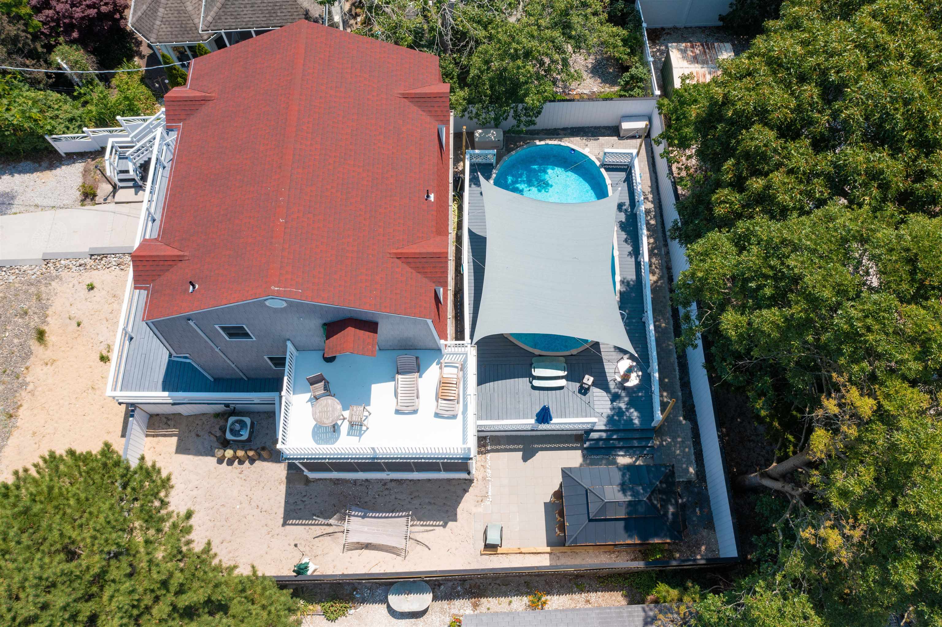 18 Pinewood Road Cape May, NJ 08204 - Photo 50 of 50 an aerial view of a house with a yard and a large pool