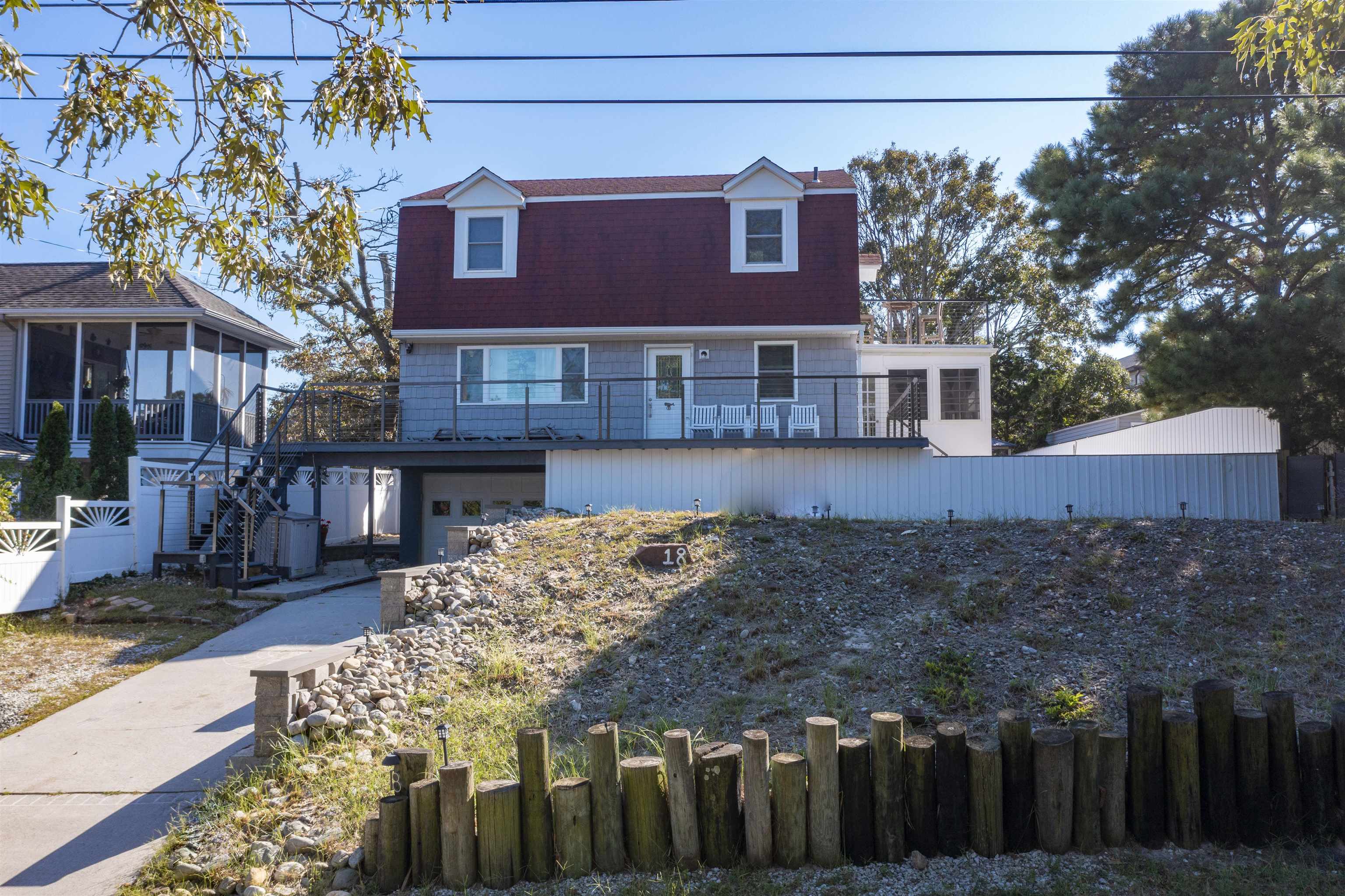 18 Pinewood Road Cape May, NJ 08204 - Photo 6 of 50 a front view of a house with a yard