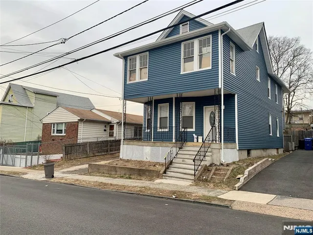a front view of a house with a garage