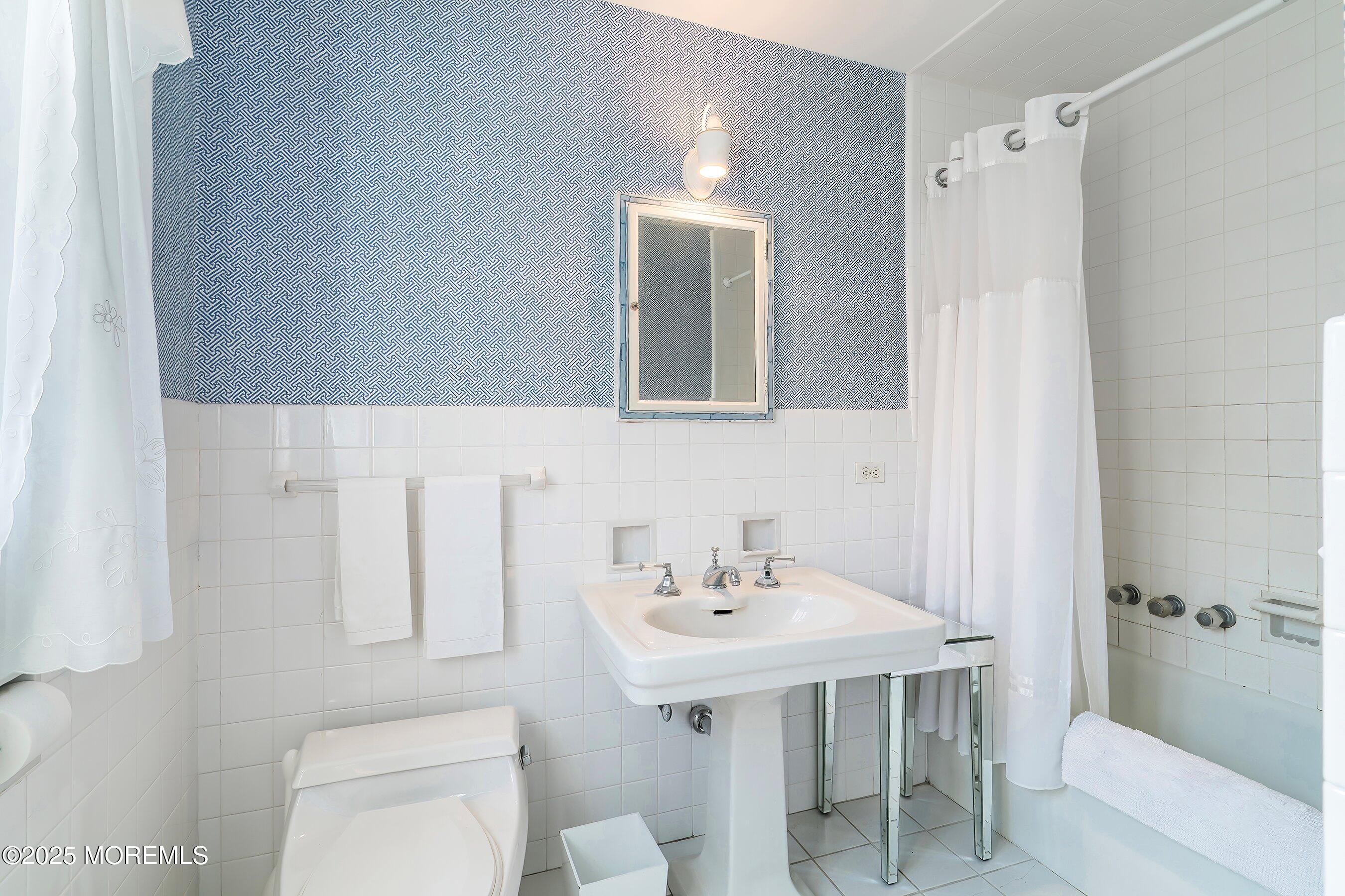 14 Fair Haven Road Rumson, NJ 07760 - Photo 31 of 51 a bathroom with a sink a toilet and shower