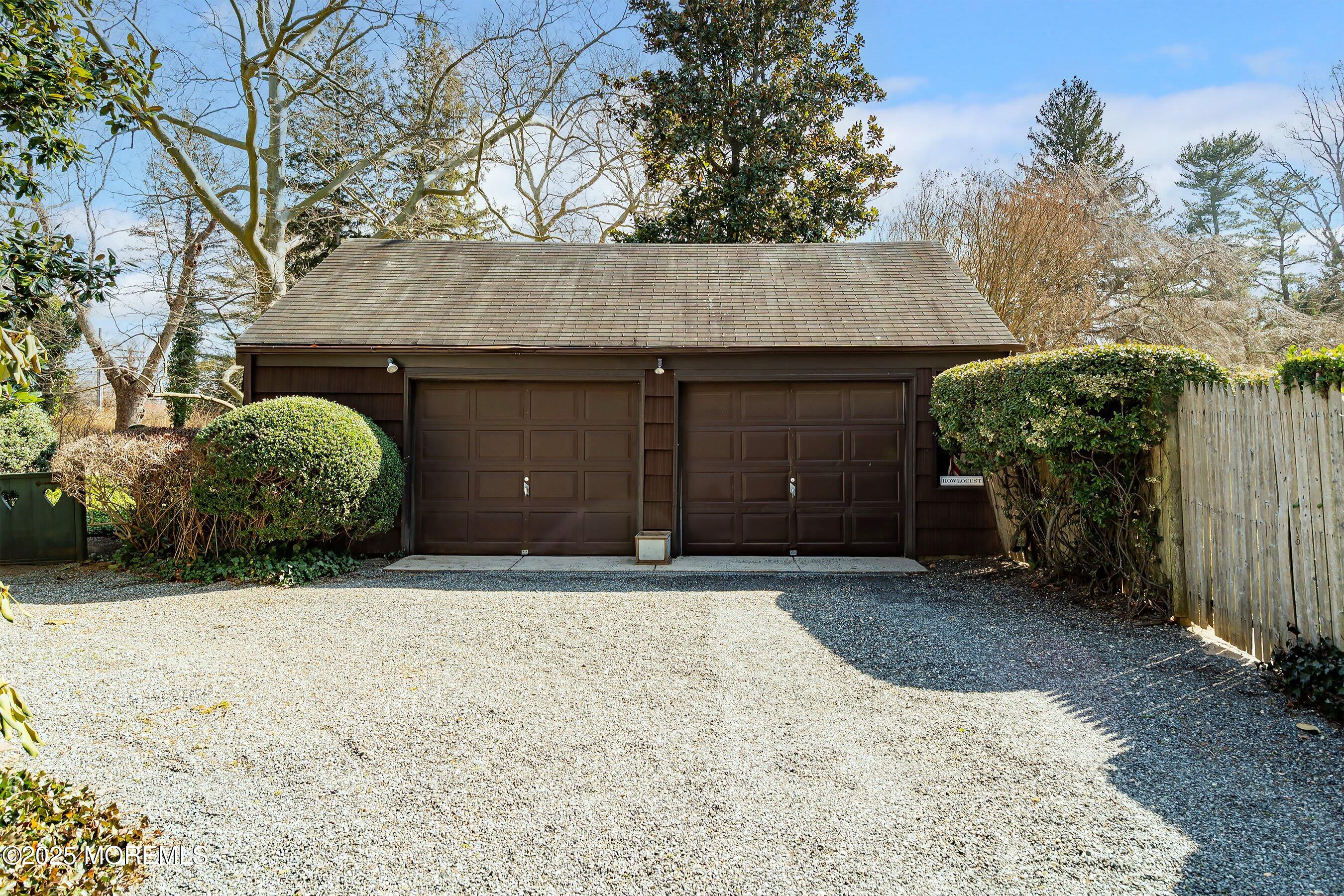 14 Fair Haven Road Rumson, NJ 07760 - Photo 48 of 51 a front view of a house with a yard and garage