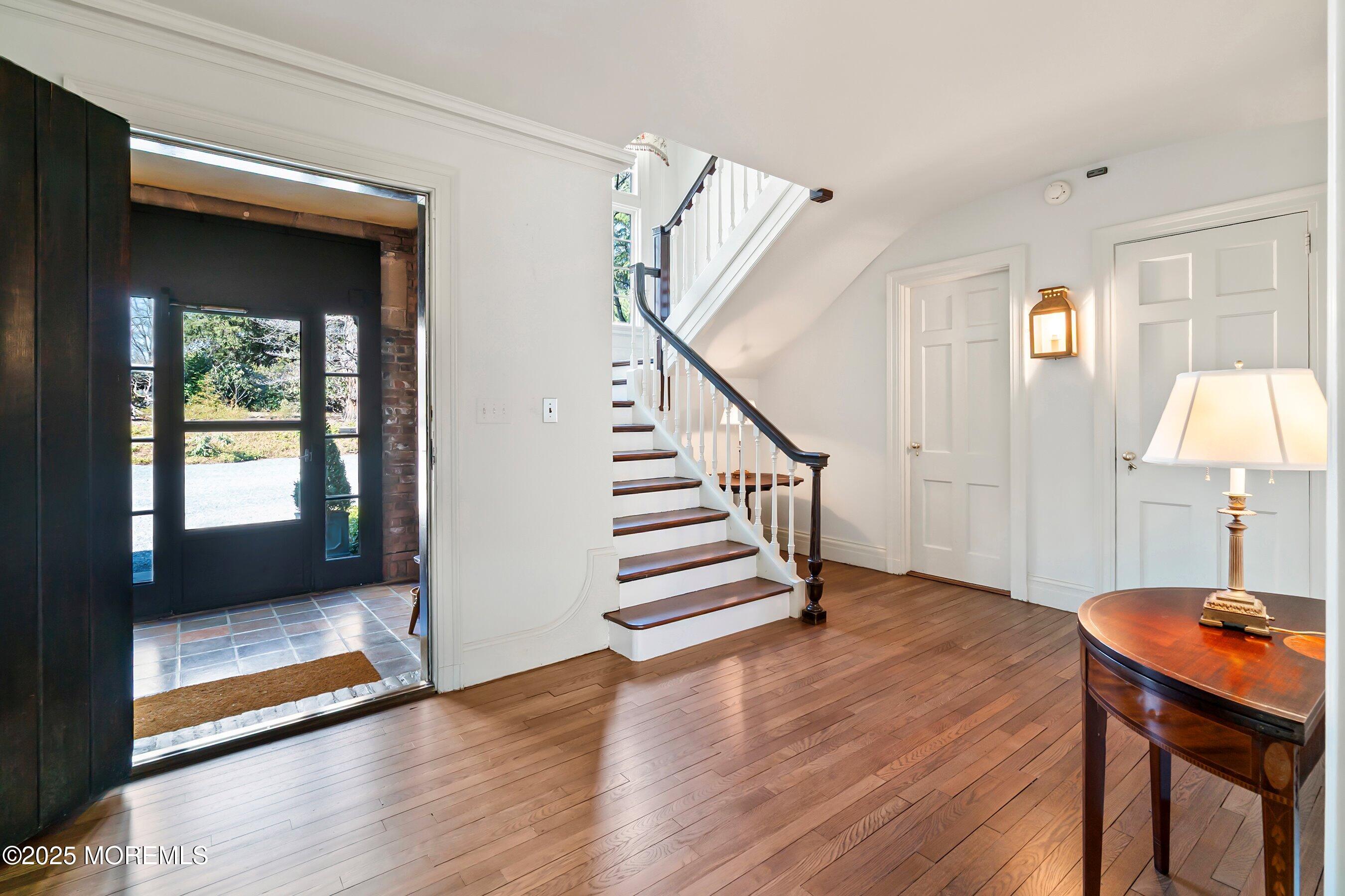 14 Fair Haven Road Rumson, NJ 07760 - Photo 10 of 51 a view of a hallway with wooden floor and staircase