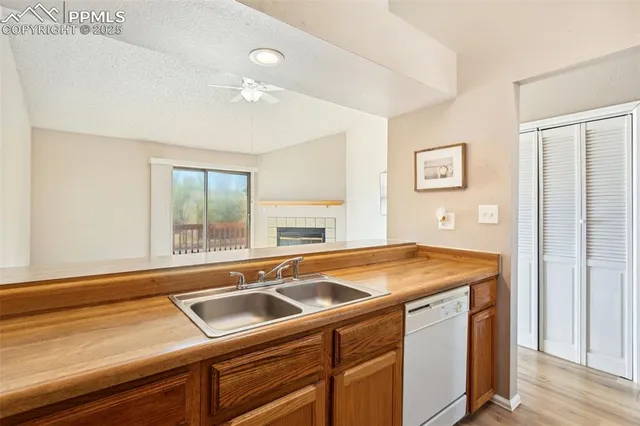 a room that has a sink and a wooden floor