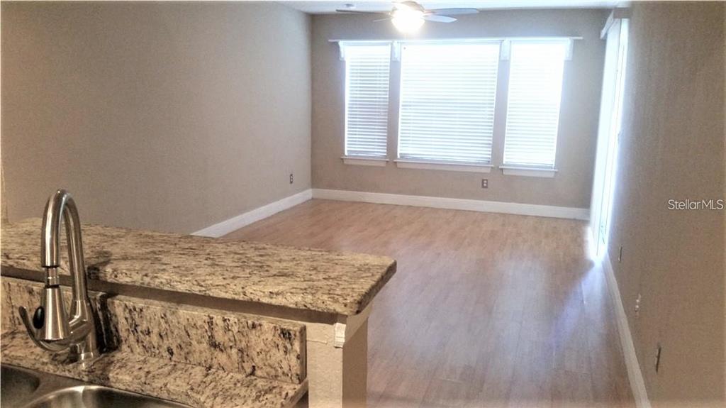 1049 South Hiawassee Road, Unit 3416 Orlando, FL 32835 - Photo 8 of 20 a view of an empty room and window