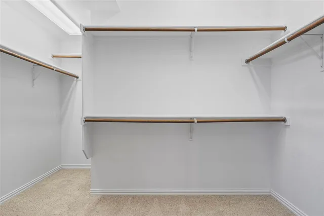 a view of a yard with porch and wooden fence