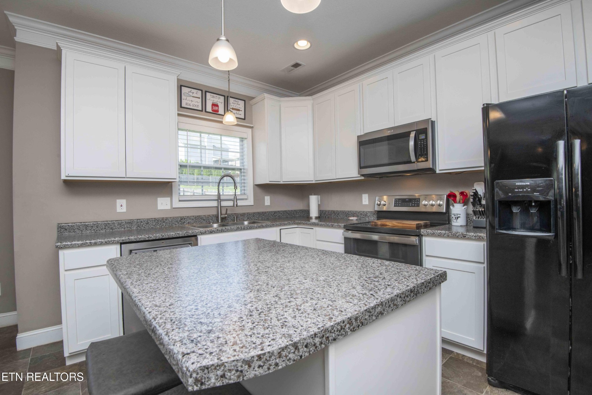 3035 Crosswinds Lane Sevierville, TN 37876 - Photo 12 of 51 a kitchen with a refrigerator microwave and sink