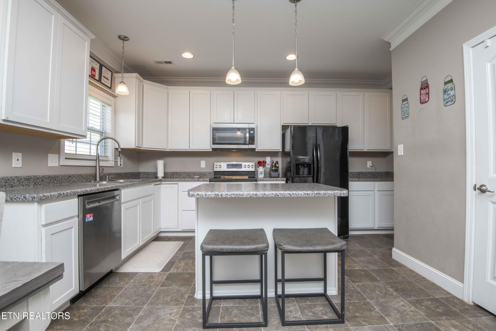 3035 Crosswinds Lane Sevierville, TN 37876 - Photo 13 of 51 a kitchen with kitchen island cabinets and refrigerator
