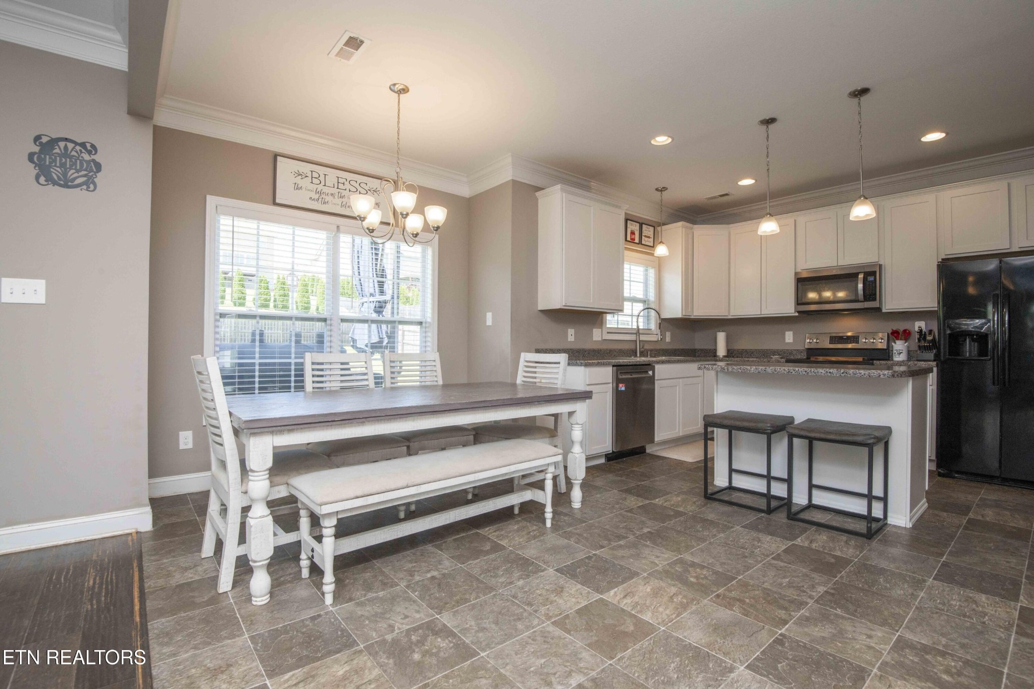 3035 Crosswinds Lane Sevierville, TN 37876 - Photo 14 of 51 a kitchen with counter top space appliances and windows