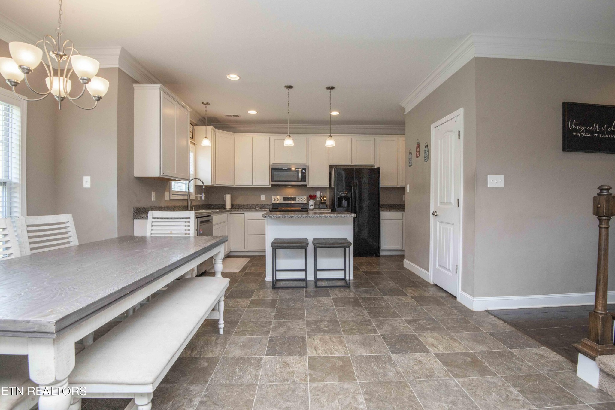 3035 Crosswinds Lane Sevierville, TN 37876 - Photo 16 of 51 a kitchen with stainless steel appliances kitchen island granite countertop a sink and cabinets