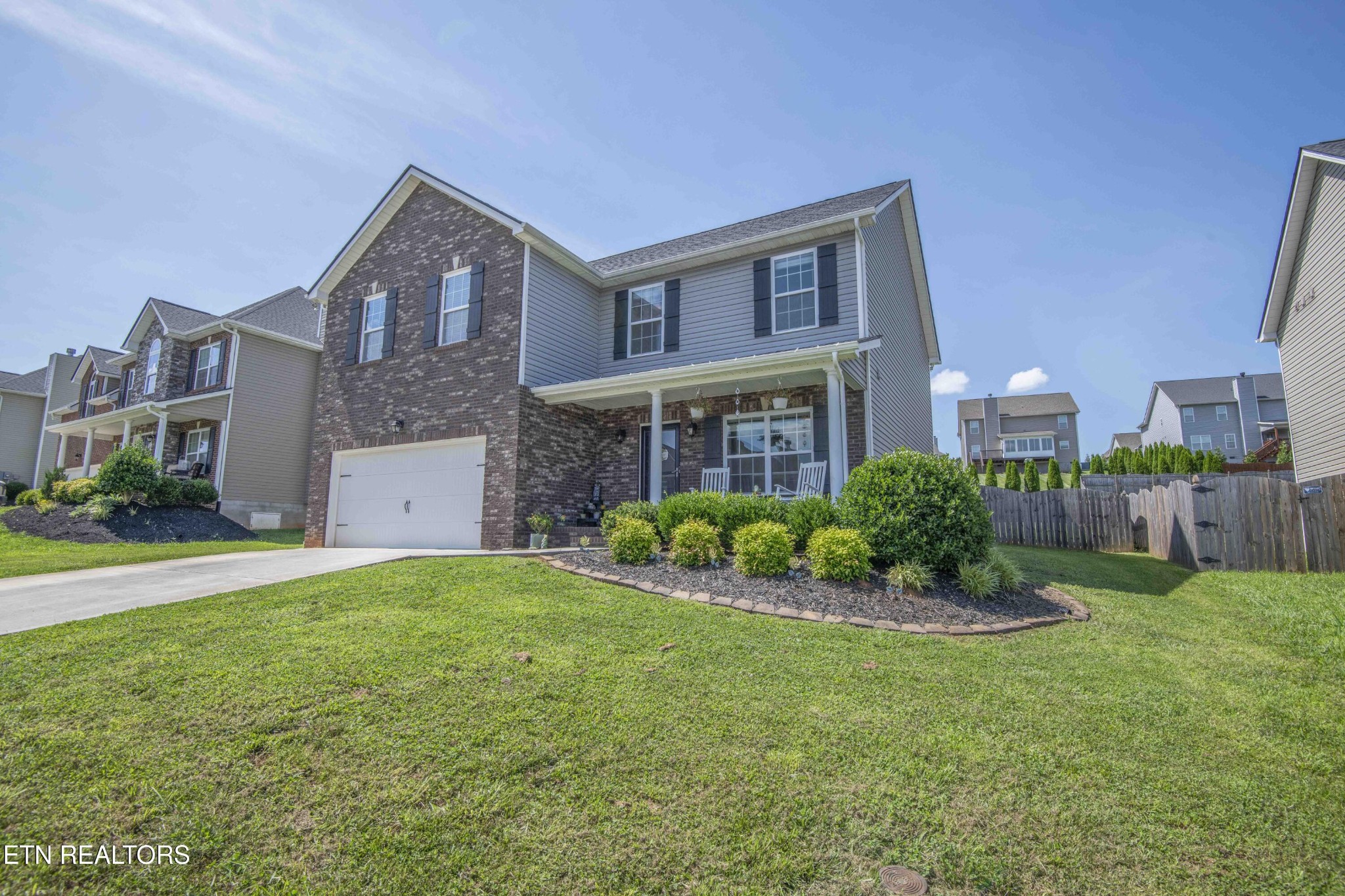 3035 Crosswinds Lane Sevierville, TN 37876 - Photo 2 of 51 a front view of a house with a yard and garage
