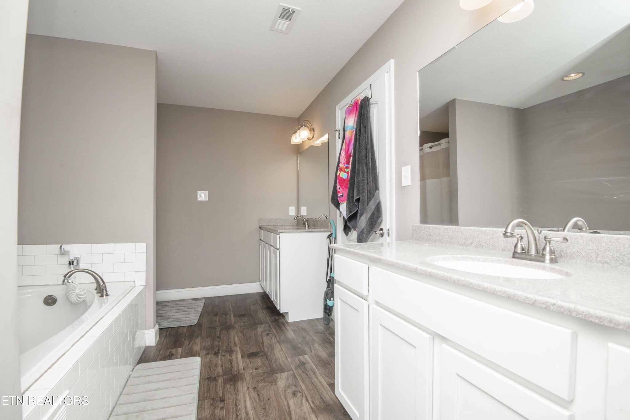 3035 Crosswinds Lane Sevierville, TN 37876 - Photo 27 of 51 a bathroom with a bathtub sink and mirror