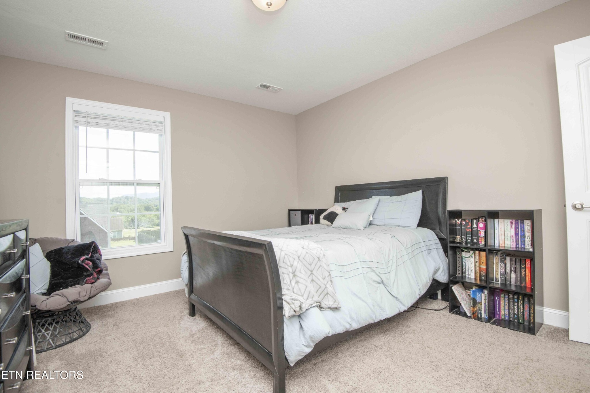 3035 Crosswinds Lane Sevierville, TN 37876 - Photo 30 of 51 a bedroom with a bed and a window