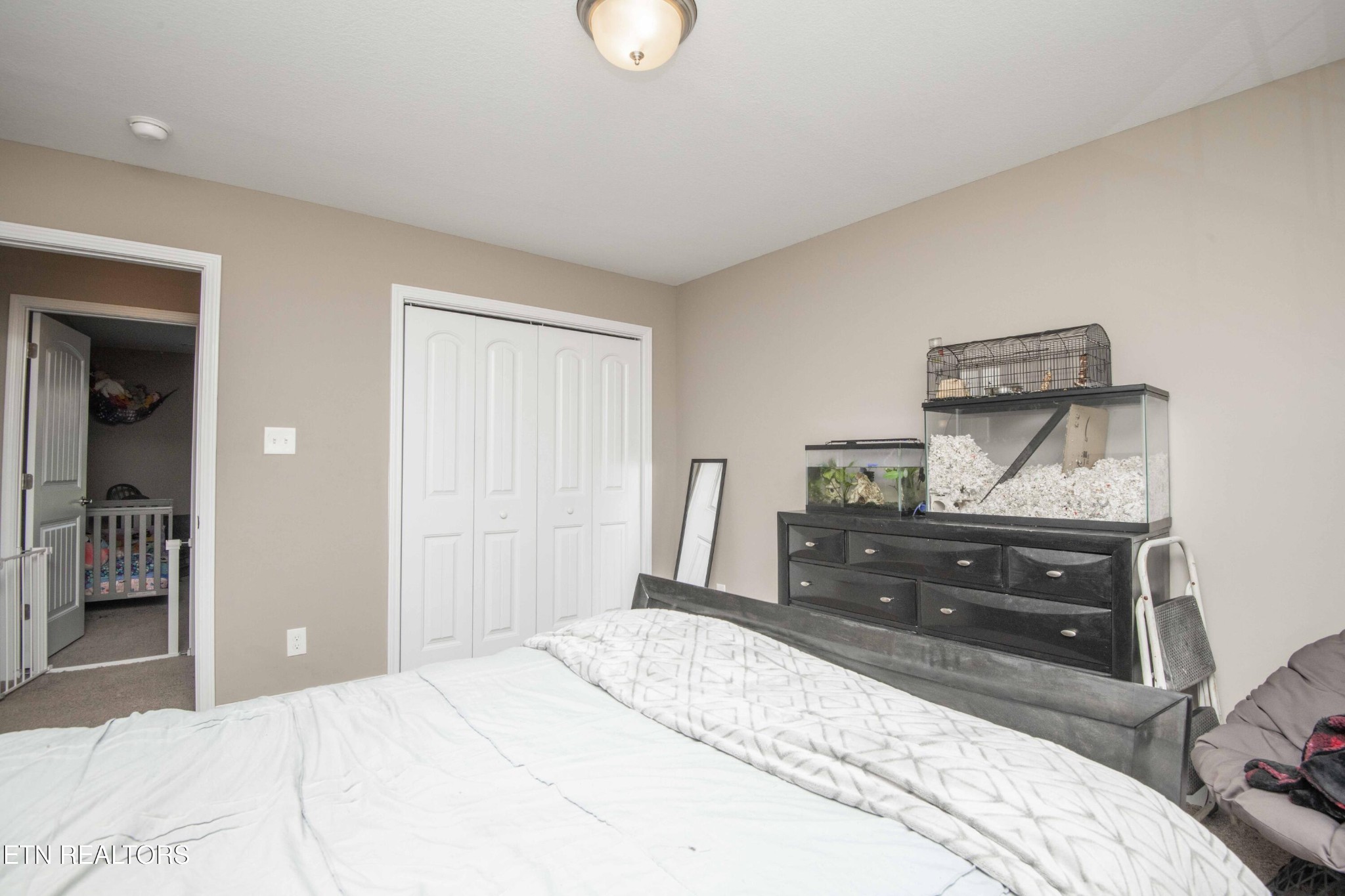 3035 Crosswinds Lane Sevierville, TN 37876 - Photo 31 of 51 a bedroom with a bed and a dresser