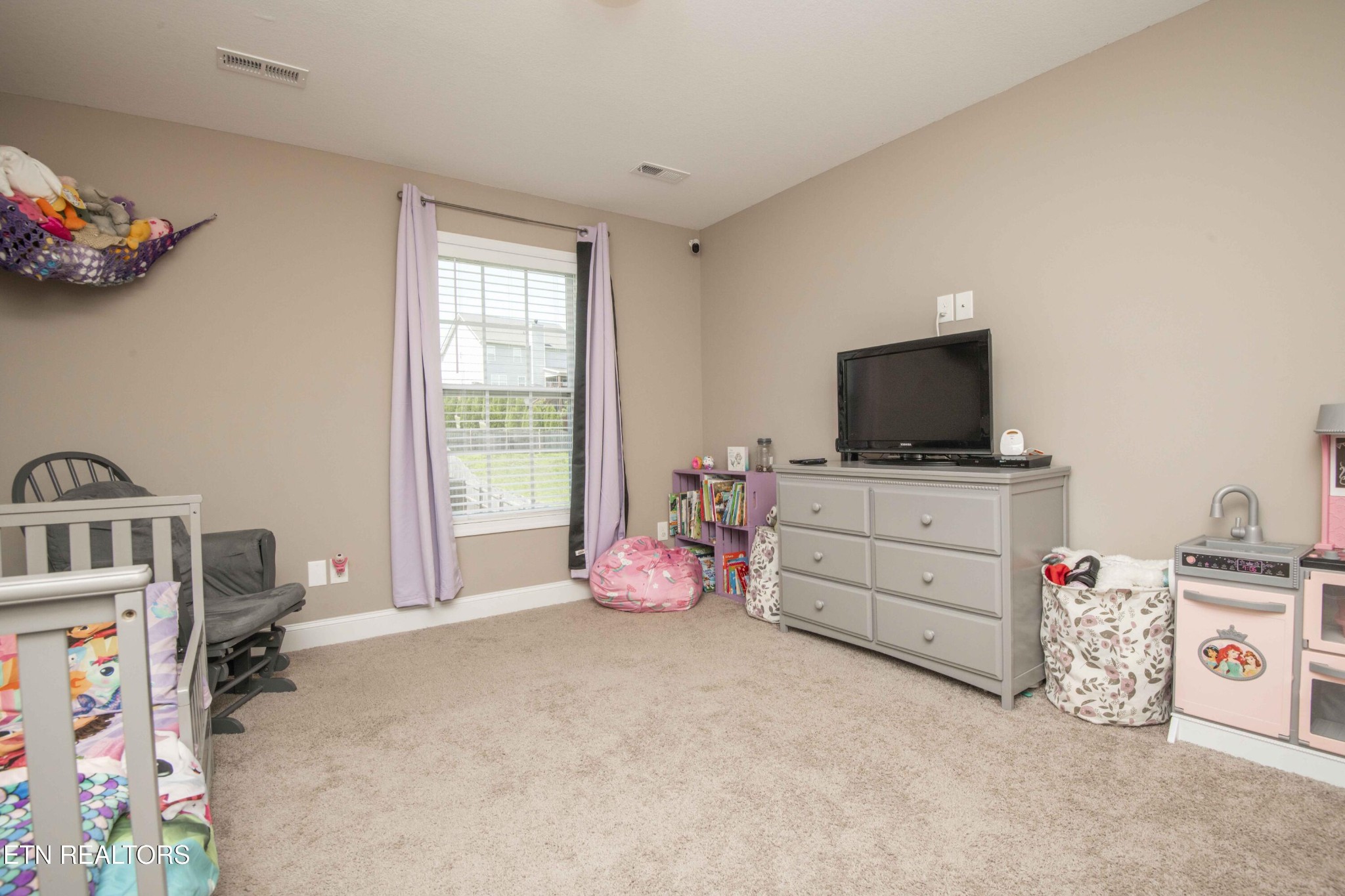 3035 Crosswinds Lane Sevierville, TN 37876 - Photo 35 of 51 a bedroom with furniture and a flat screen tv