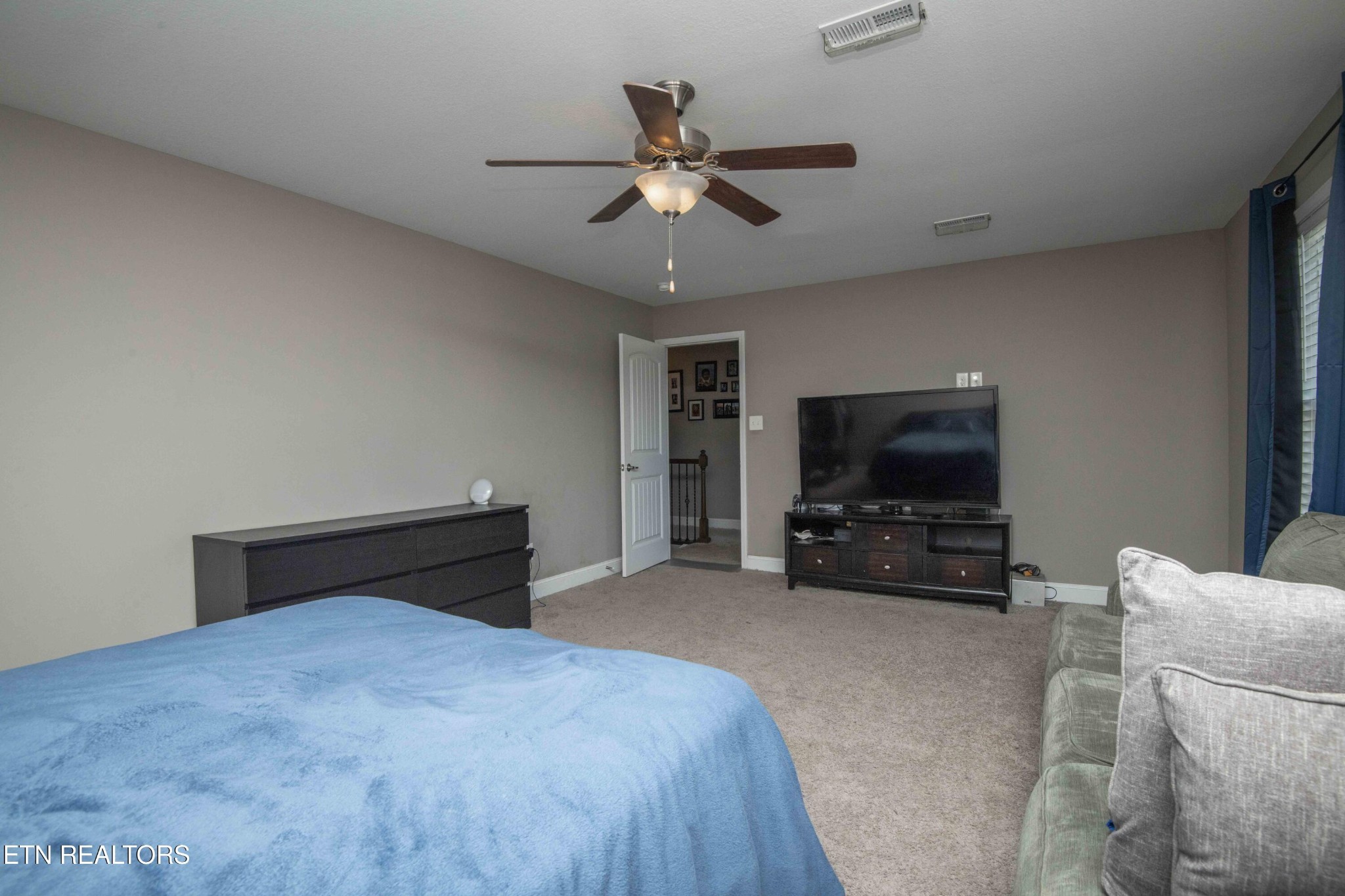 3035 Crosswinds Lane Sevierville, TN 37876 - Photo 40 of 51 a bedroom with furniture and a flat screen tv