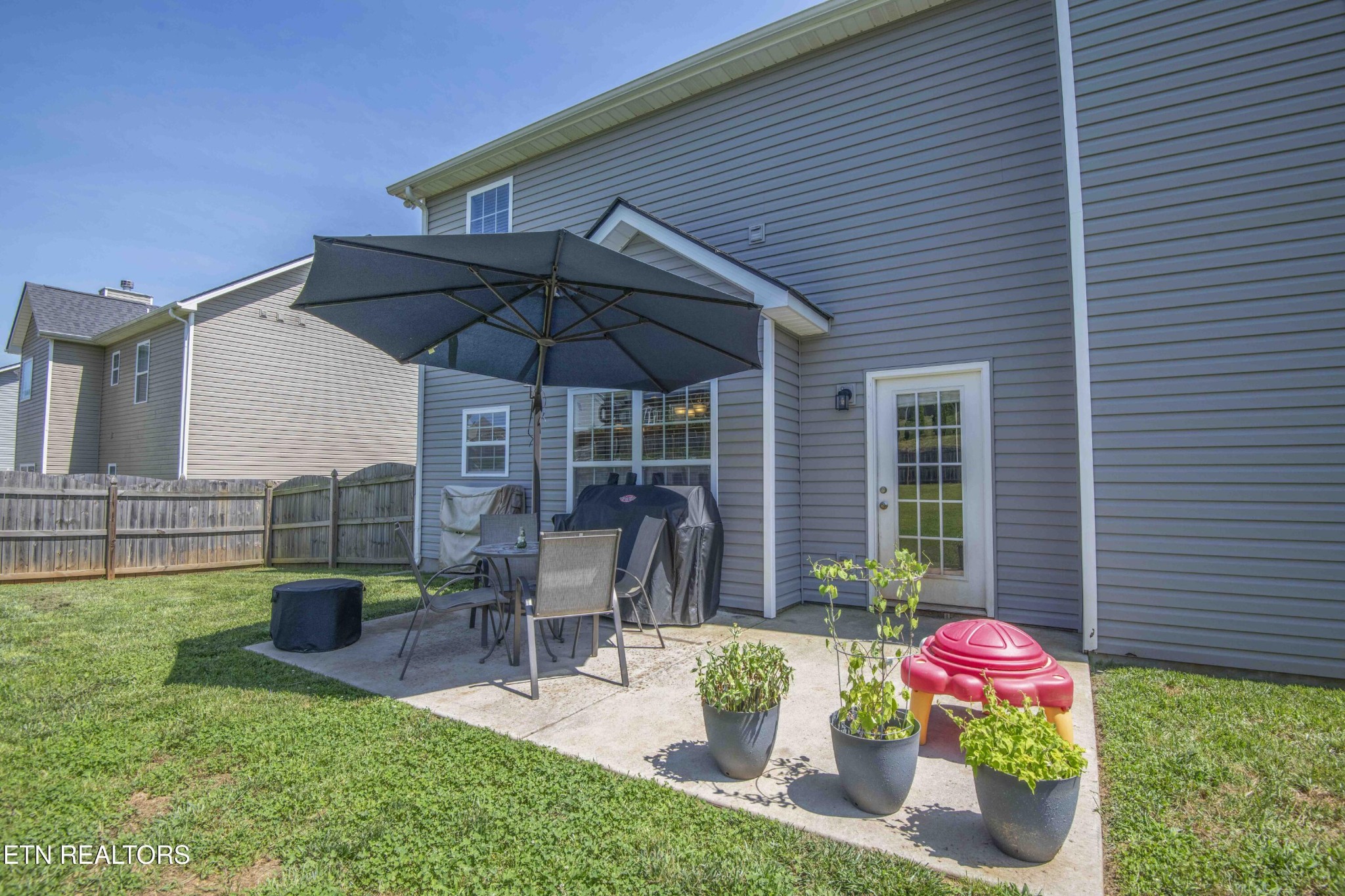 3035 Crosswinds Lane Sevierville, TN 37876 - Photo 44 of 51 a view of a chair and table in backyard of the house