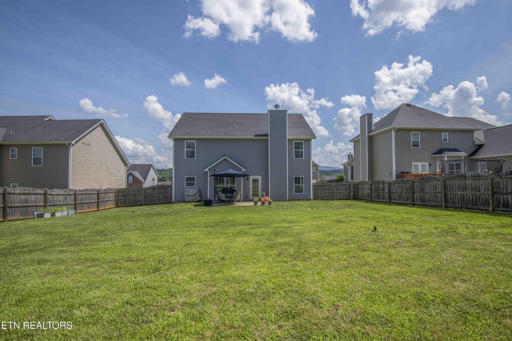 3035 Crosswinds Lane Sevierville, TN 37876 - Photo 46 of 51 a view of a house with a big yard and large tree