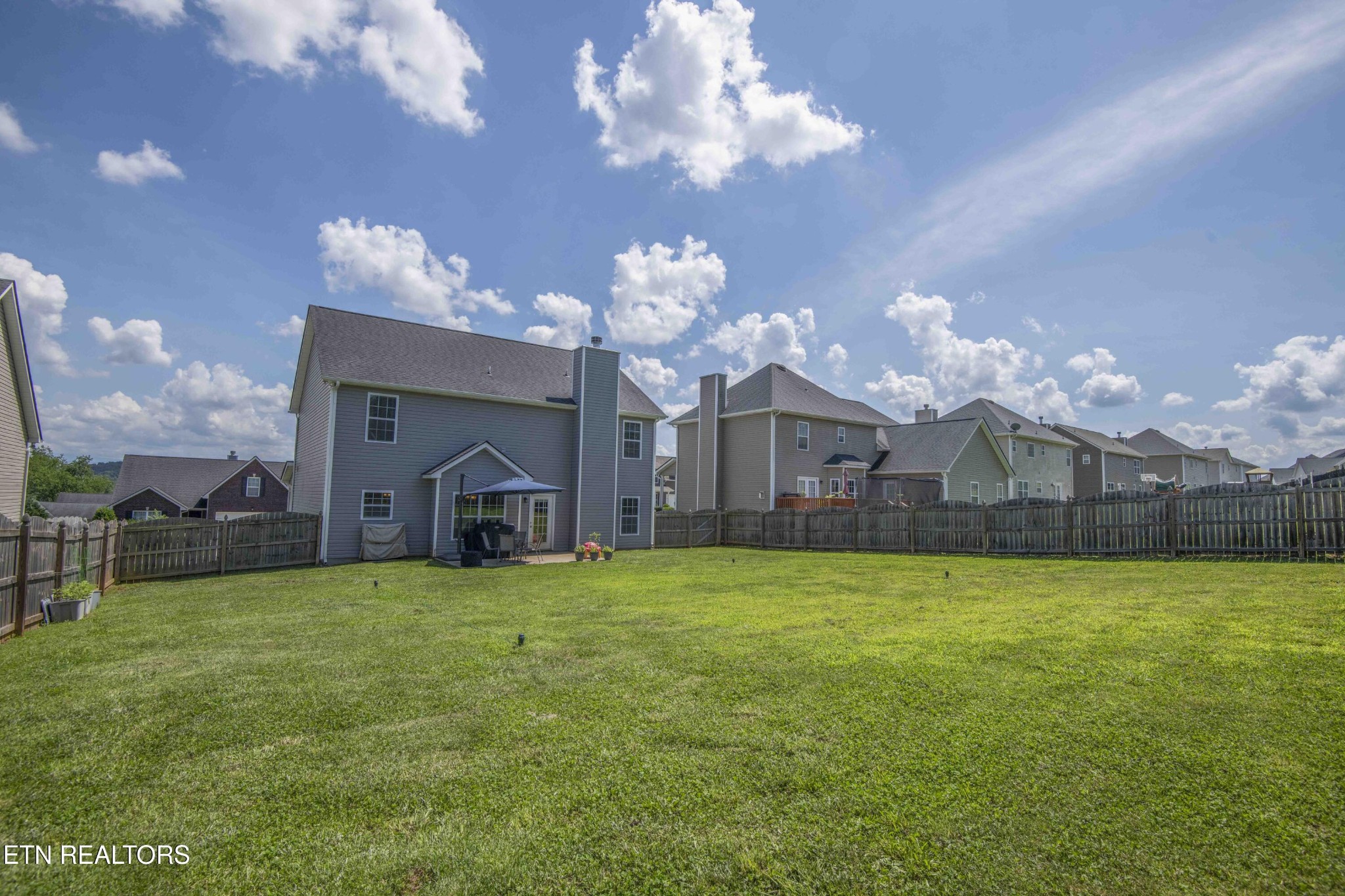 3035 Crosswinds Lane Sevierville, TN 37876 - Photo 47 of 51 a view of a house with a large yard and a large tree