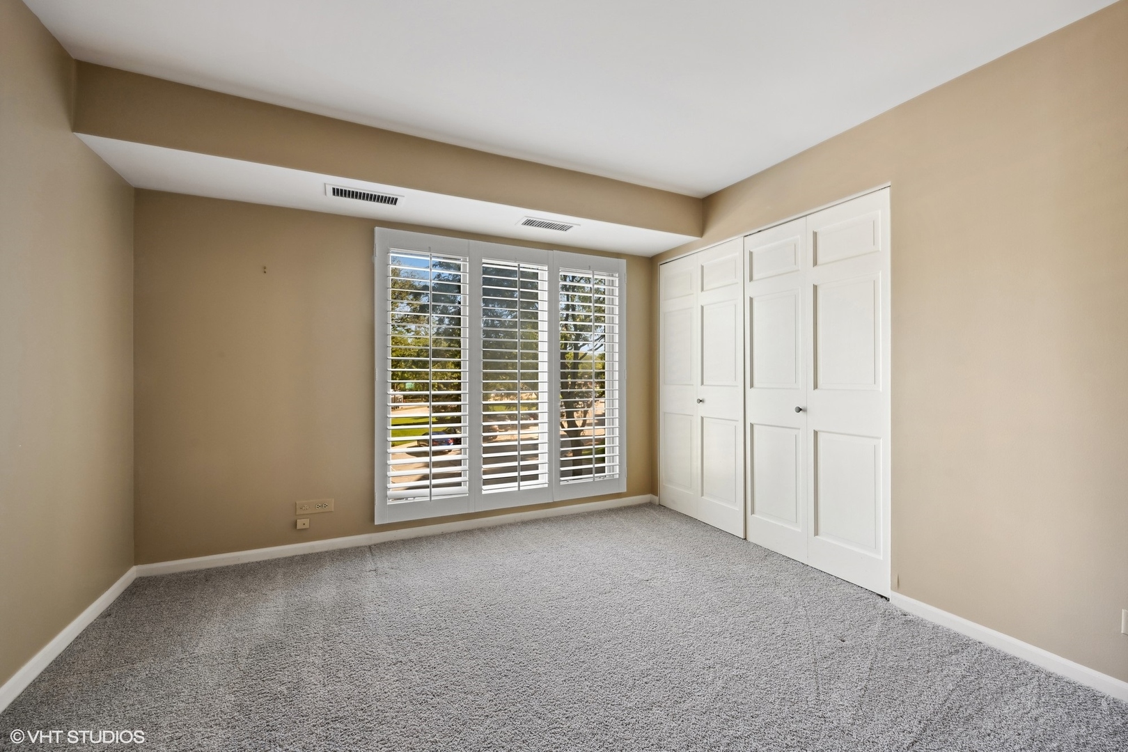 3851 Mission Hills Road, Unit 203 Northbrook, IL 60062 - Photo 13 of 21 a view of an empty room with a window