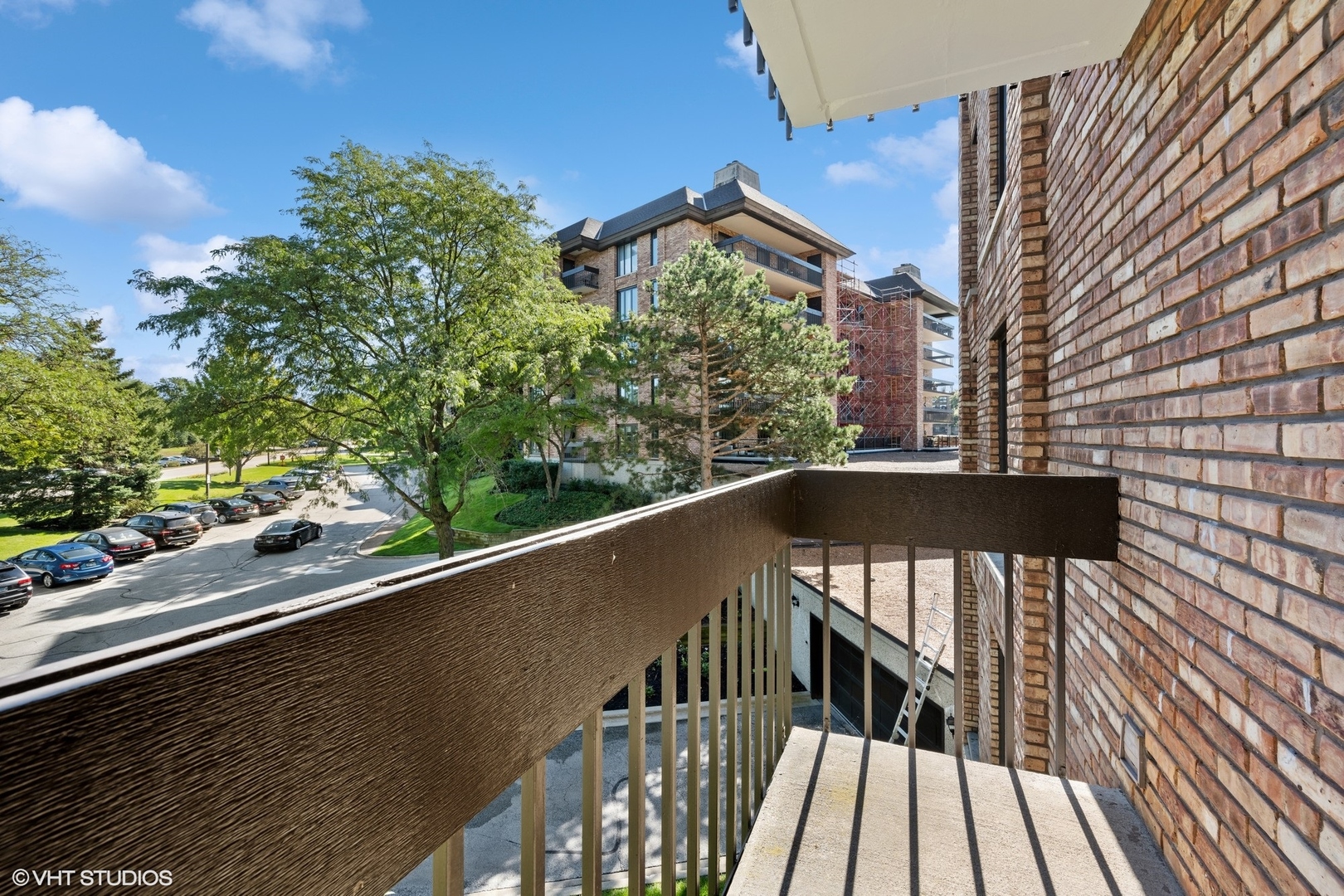 3851 Mission Hills Road, Unit 203 Northbrook, IL 60062 - Photo 16 of 21 a view of balcony with wooden floor and fence