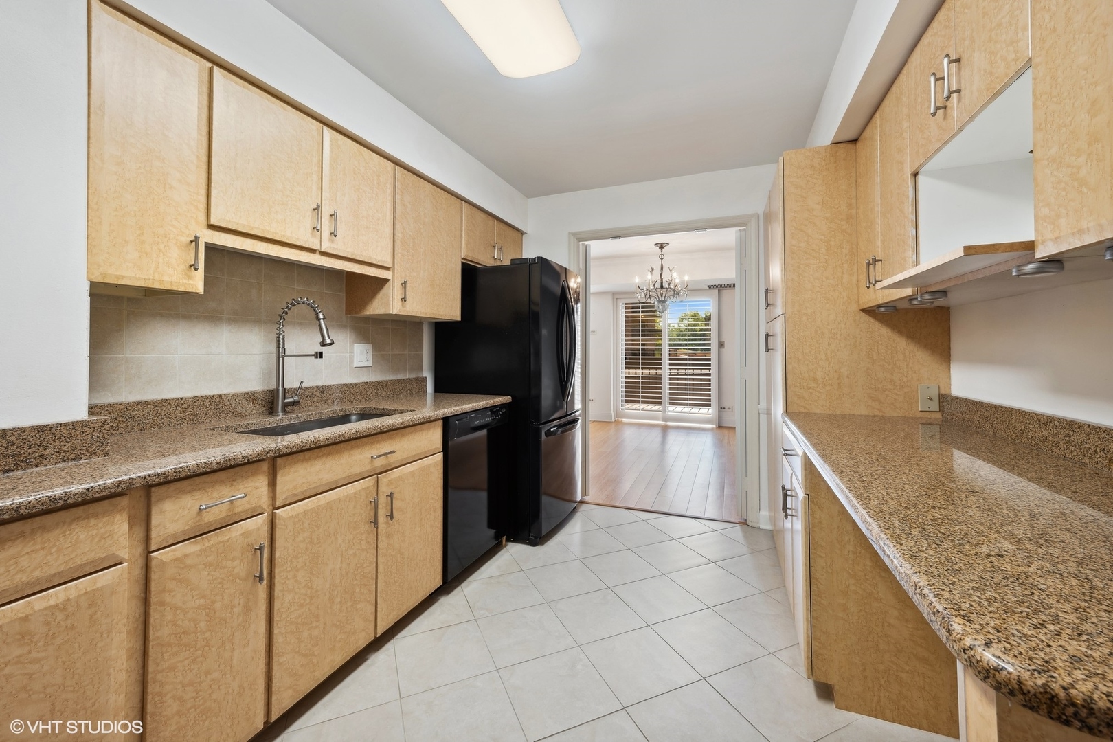 3851 Mission Hills Road, Unit 203 Northbrook, IL 60062 - Photo 7 of 21 a kitchen with stainless steel appliances granite countertop a sink stove and refrigerator