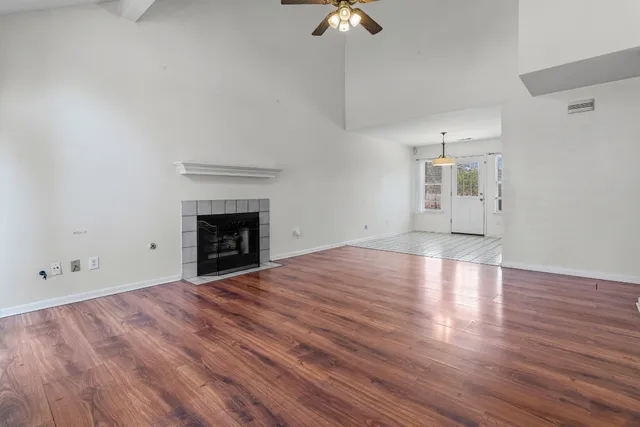 wooden floor in an empty room with a window