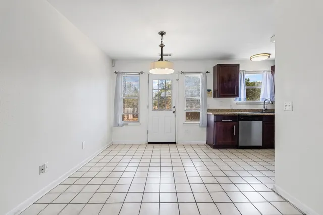 a kitchen with a sink a stove and refrigerator